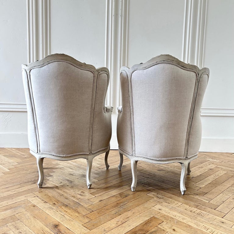 Pair of Vintage Painted and Linen Upholstered wingback Chairs For Sale