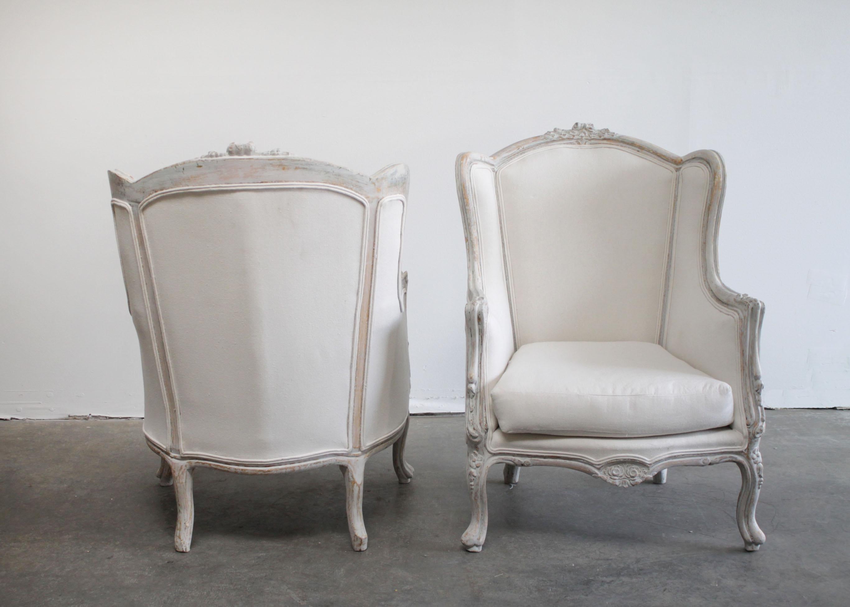 Pair of Vintage Painted French Style Wing Back Bergere Chairs In Good Condition In Brea, CA