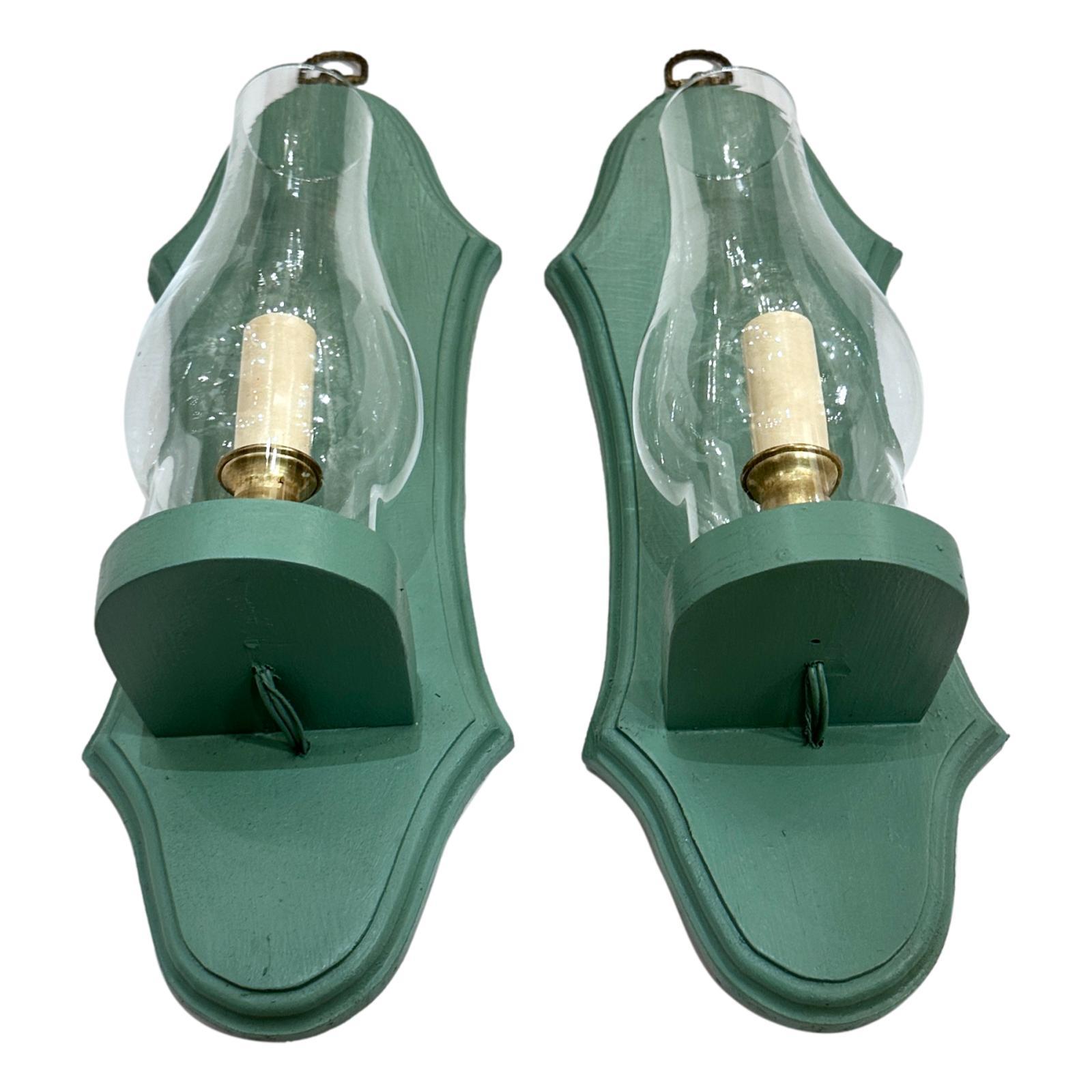 Pair of circa 1950's American painted wood sconces with hurricanes.

Measurements:
Height: 17