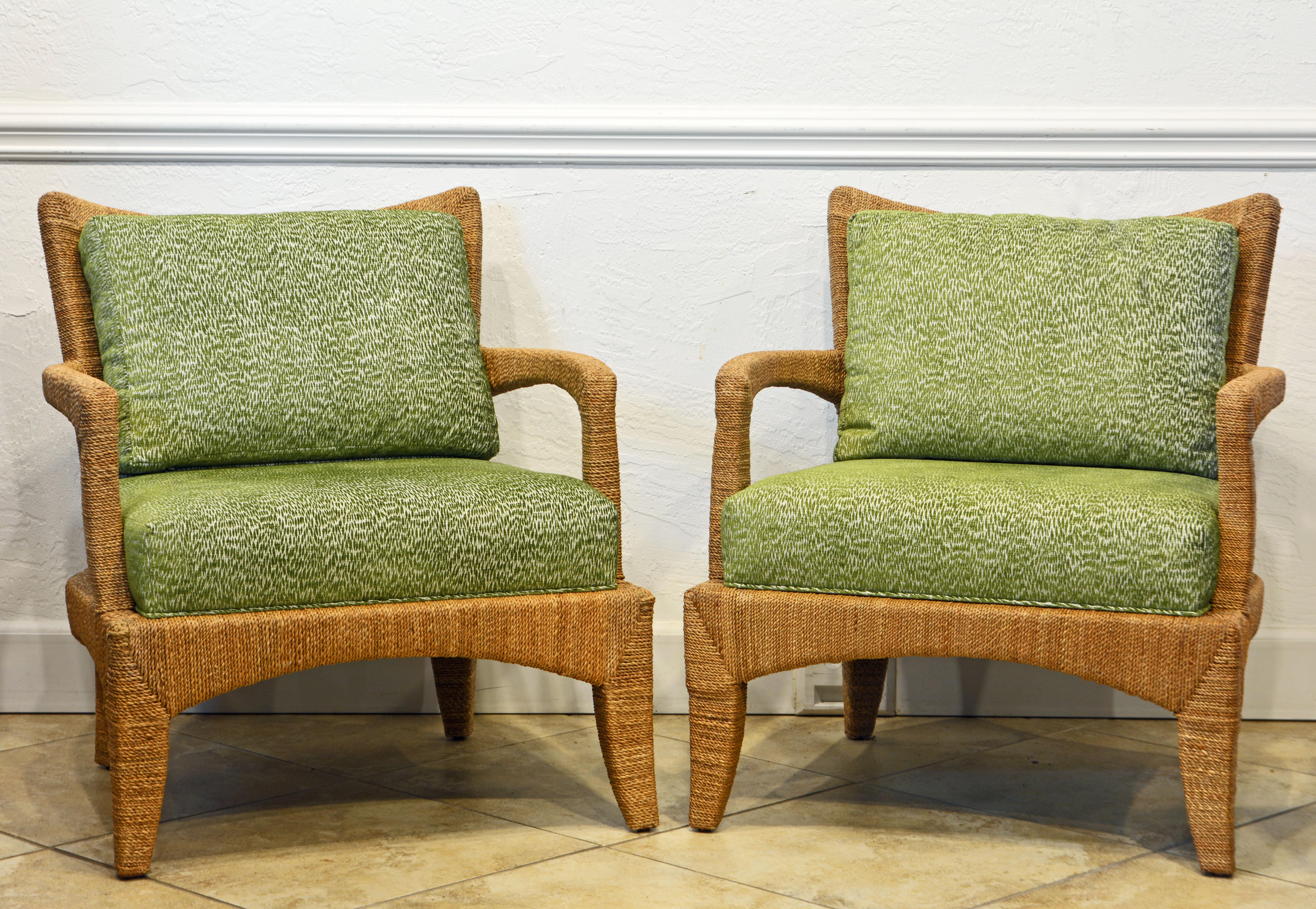 This pair of comfortable lounge chairs by Palecek consist of a hardwood frame wrapped with natural seagrass fiber in a pleasing pattern. With their organic pattern green tint cushions they will add a coastal and tropical flair to the interior.