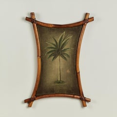 Paire de peintures vintage de palmiers dans des cadres en bambou