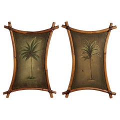 Paire de peintures vintage de palmiers dans des cadres en bambou