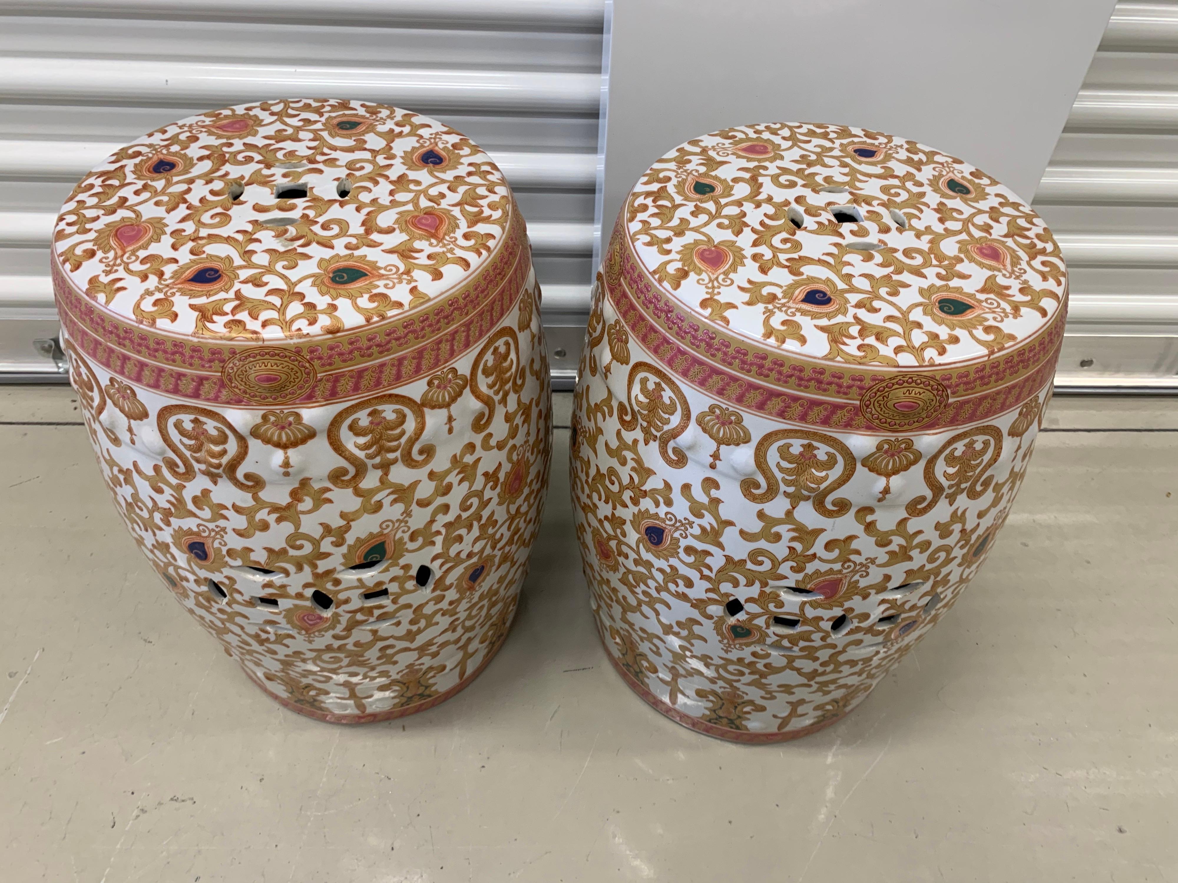 Matching pair of persimmon, white and gold vintage Asian garden stools. Great scale and color scheme.
 