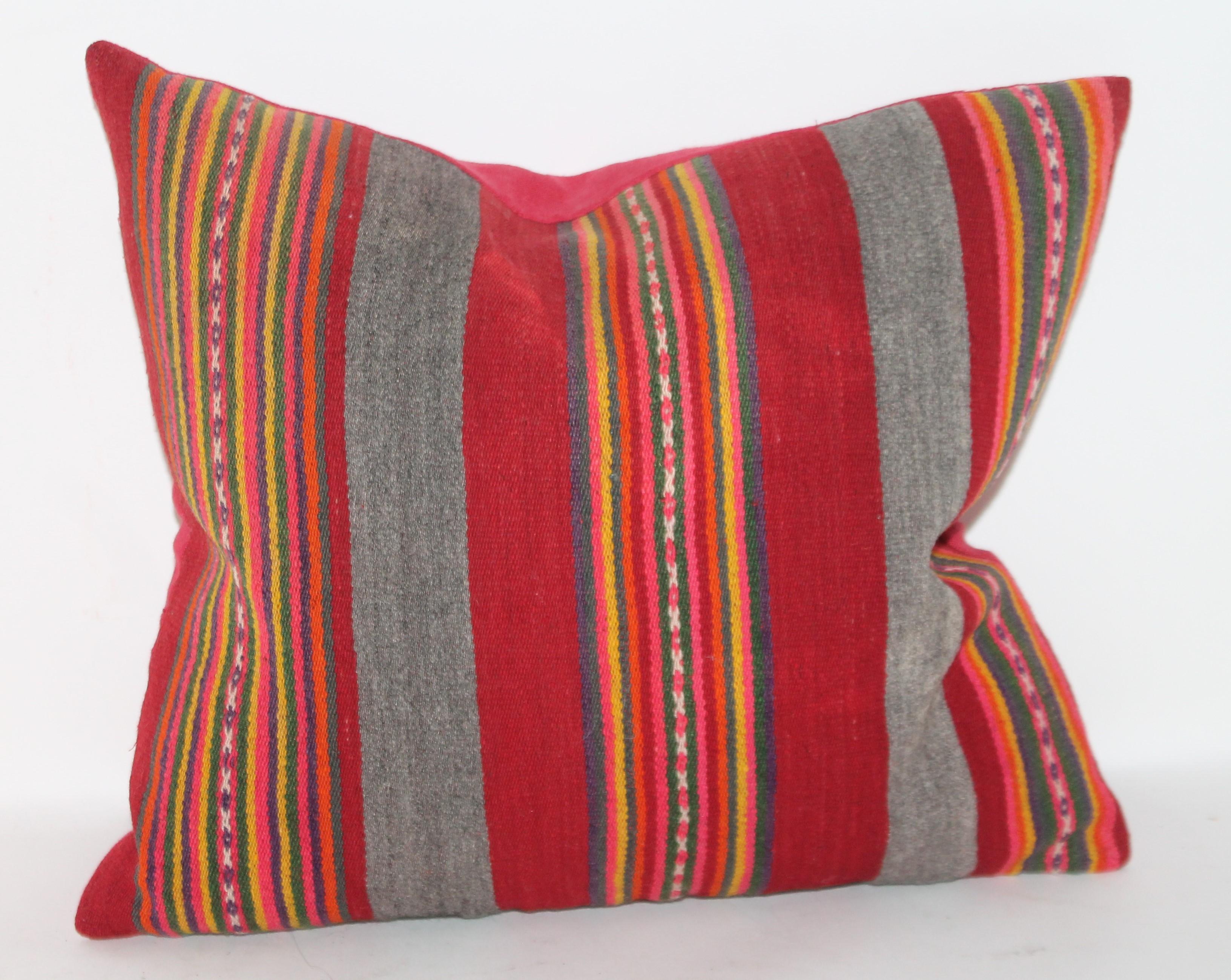 This pair of unusual Peruvian Indian weaving pillows have a red cotton linen backing and in great condition. The inserts are down and feather fill.