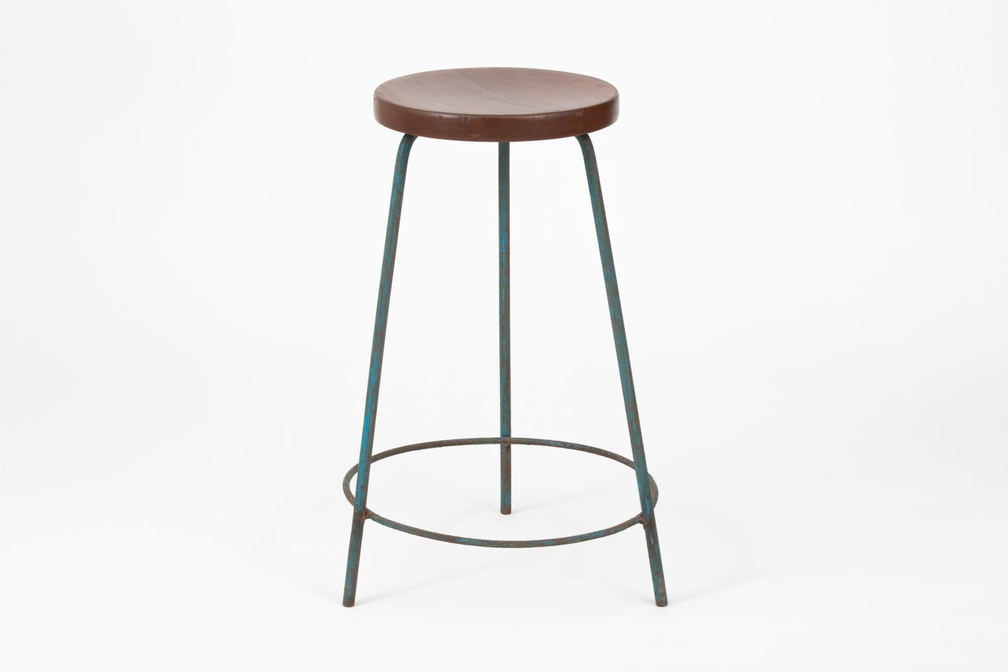 Pair of original painted iron and teak bar / work stools designed by Pierre Jeanneret. These stools were created for the famous modernist capital city of Chandigarh, India that was designed by Le Corbusier, Jeanneret, and their team. Model number