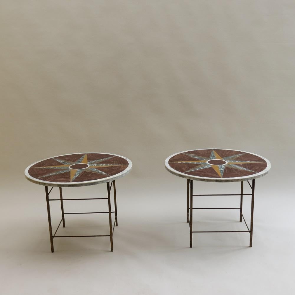 Wonderful pair of Pietra Dura tables in geometric form. Specimen marble table tops with inlaid geometric pattern, originally from Italy, date from the late 20th Century on vintage brass table bases. The table bases are made from brass and are from