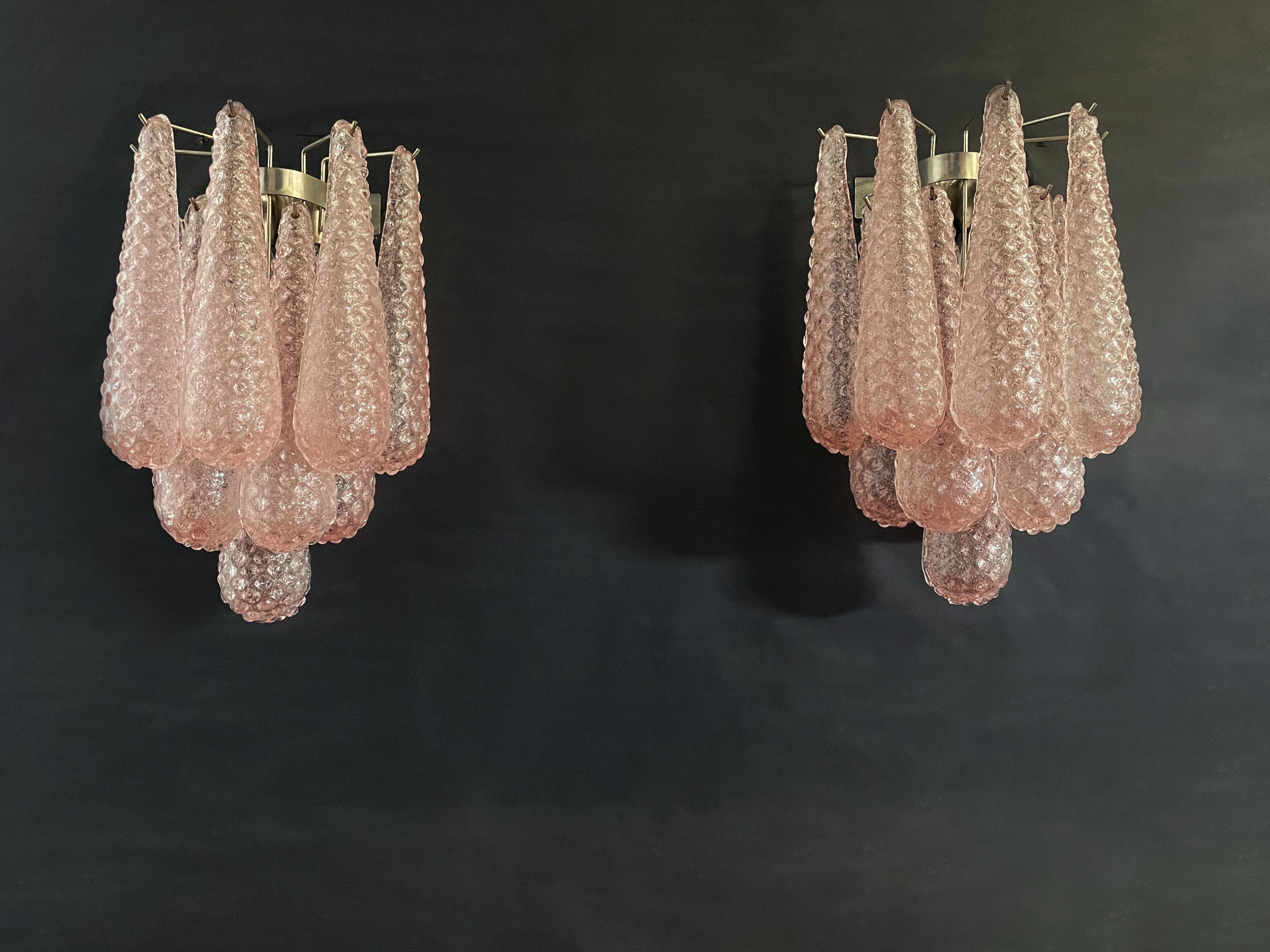 Fantastic pair of vintage Murano wall sconce made by 10 pink glass petals (transparent crystal, smooth outside, with crystal powder and then rough inside) in a chrome frame.
Period:1970'S
Dimensions: 17,70 inches height (45 cm); 13,40 inches width