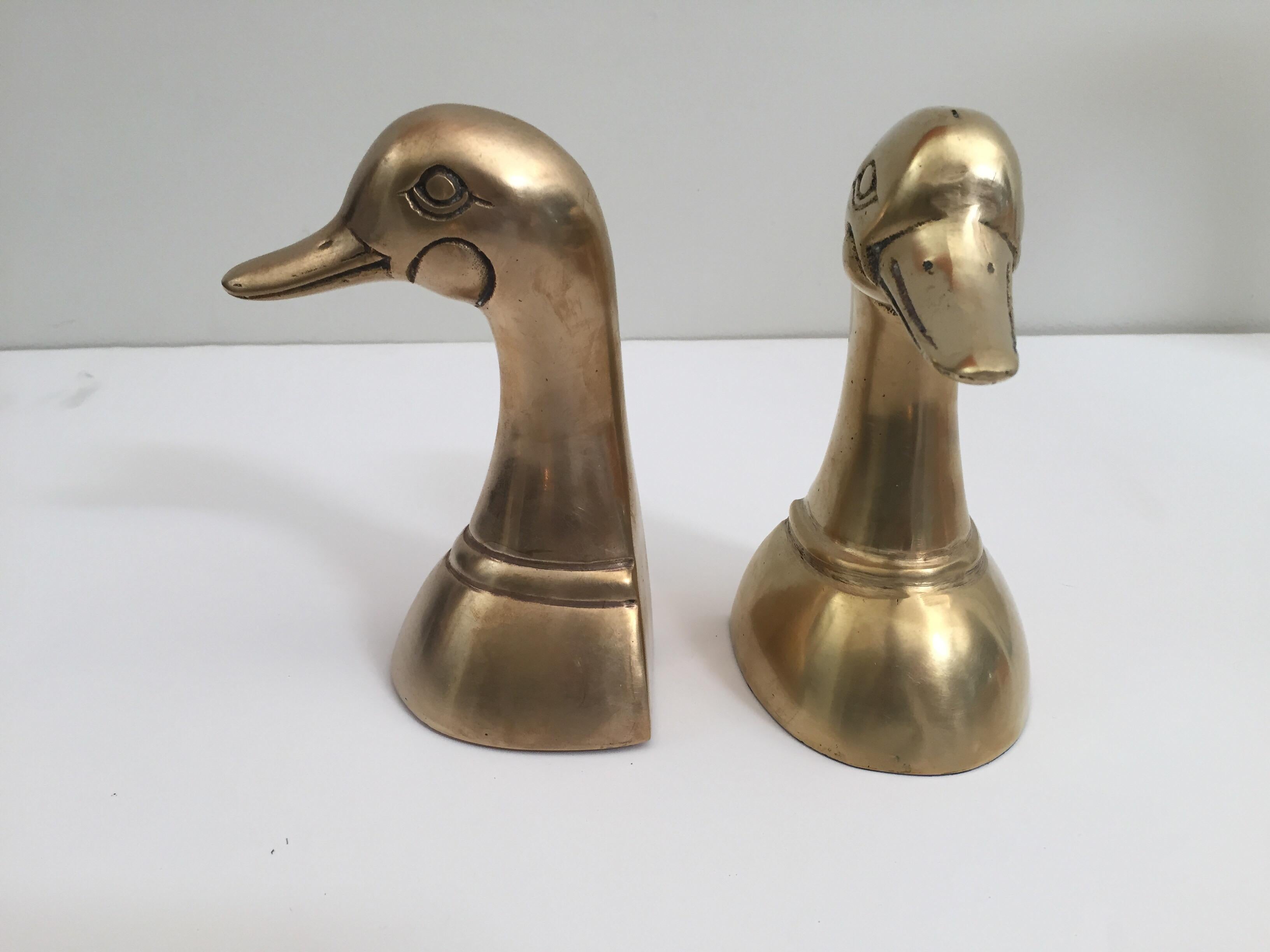 Vintage pair of polished cast brass duck bookends, circa 1950.
Pair of polished decorative brass duck bookends in Sarried style.
Very sturdy and heavy.
Pair of midcentury vintage cast metal brass duck sculpture bust bookends.
Great for holding