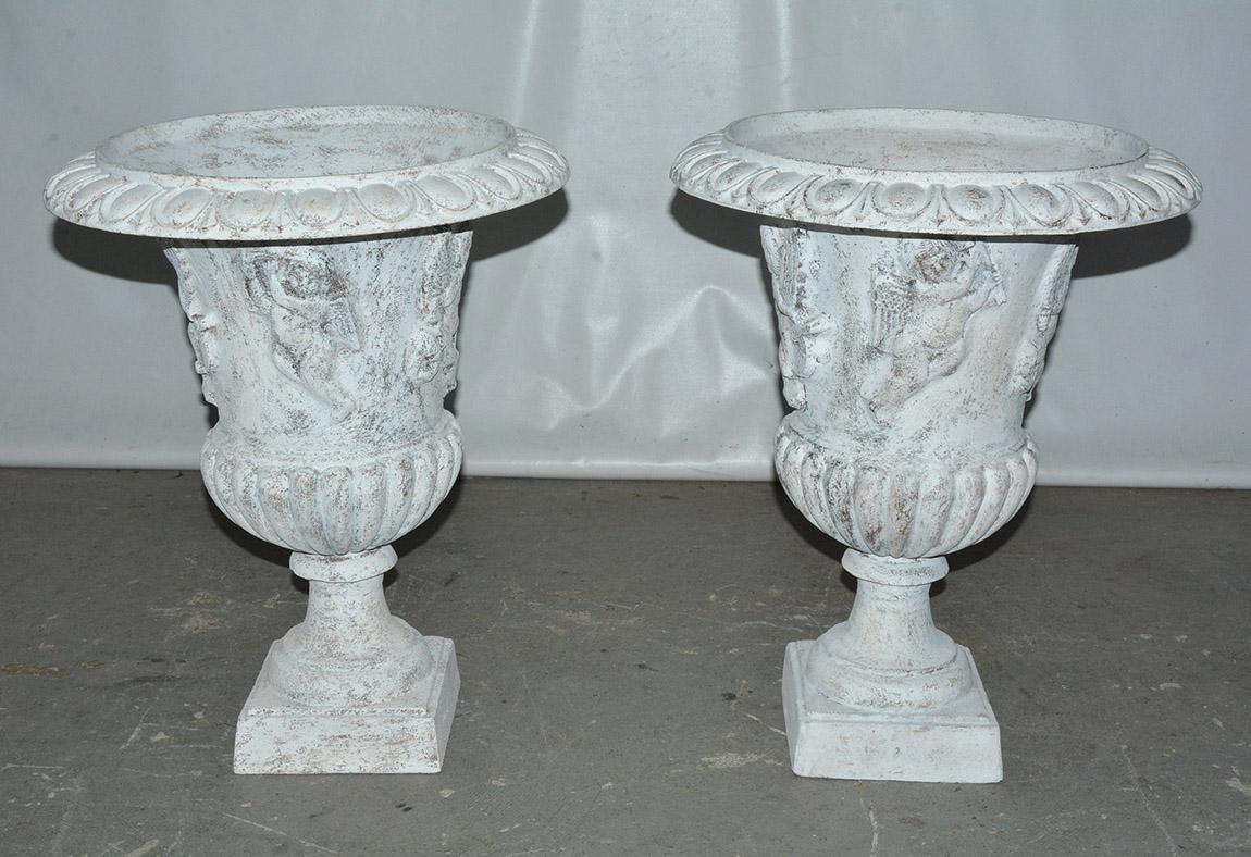 Neoclassical Revival Pair of Vintage Putti Decorated Garden Urns For Sale