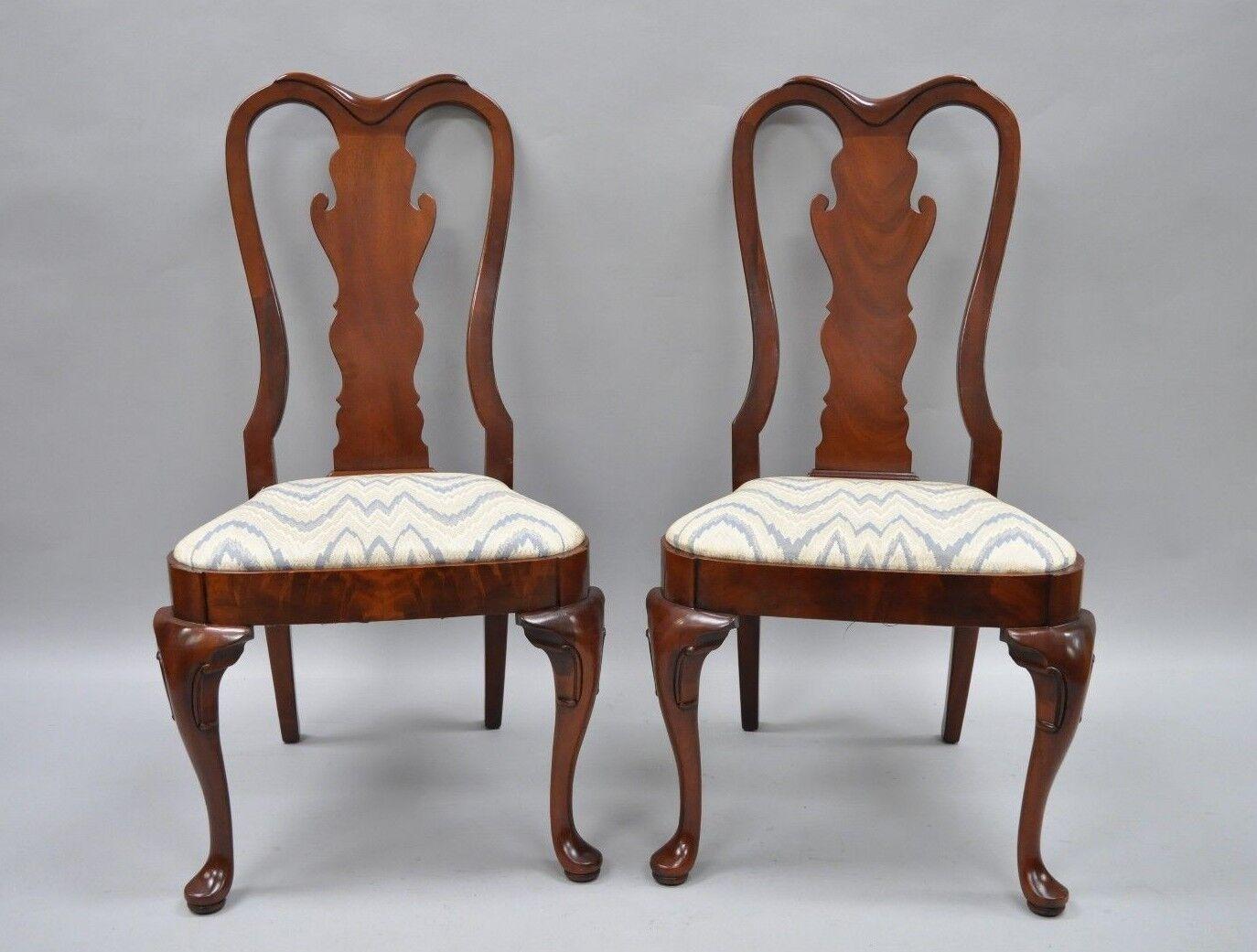 Pair of Vintage Queen Anne Style crotch mahogany dining room side chairs. Item features Queen Anne legs, solid wood frames, beautiful woodgrain, upholstered seat, quality American craftsmanship. Circa mid to late 20th century. Measurements: 41