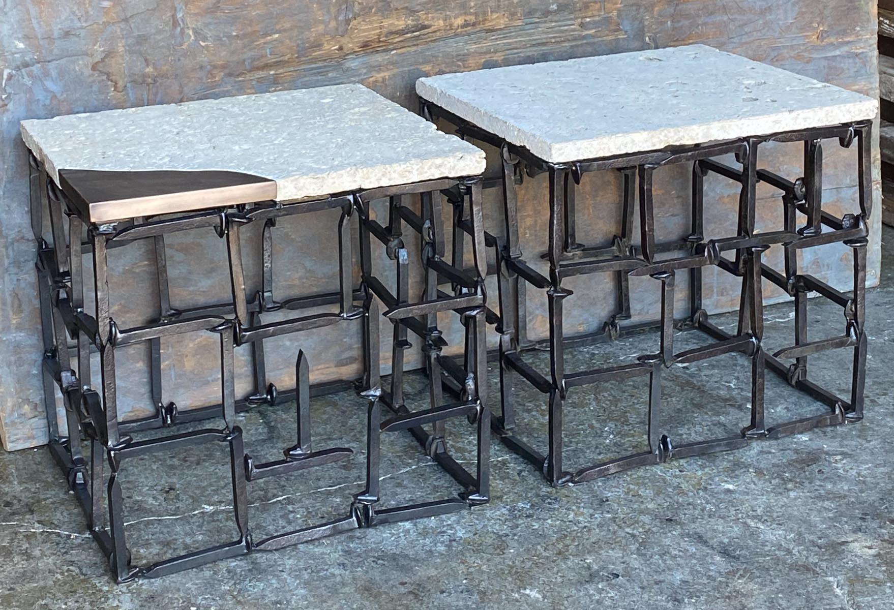 This pair of tables are made from vintage railroad spikes with Texas shell limestone tops. One table has a bronze inlay corner. The Texas shell limestone is a soft, porous white stone with visible fossils and shells, very interesting!
This is a