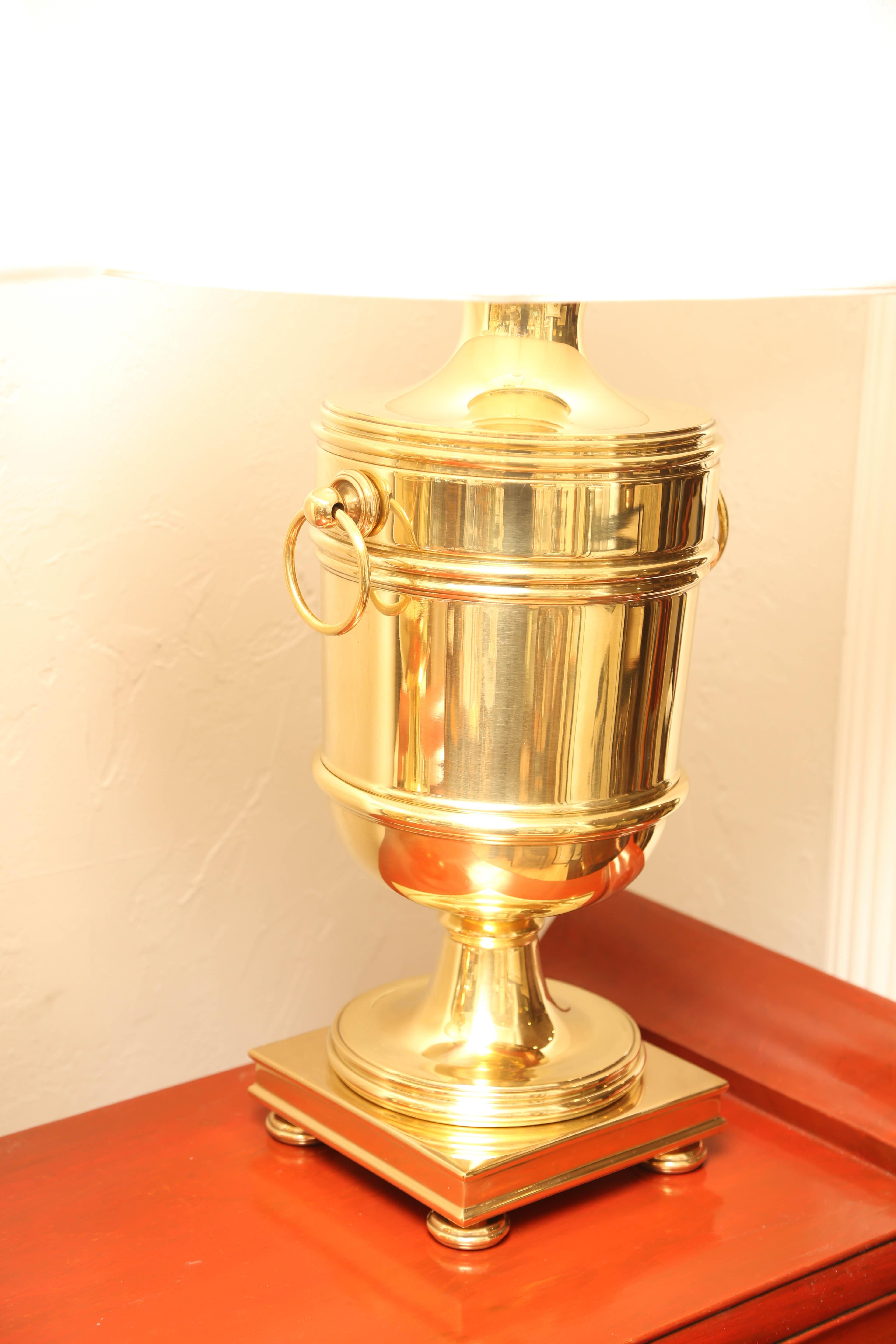 Large pair of brass urn lamps with adjustable harps by Ralph Lauren. Measures: New shades with a 19