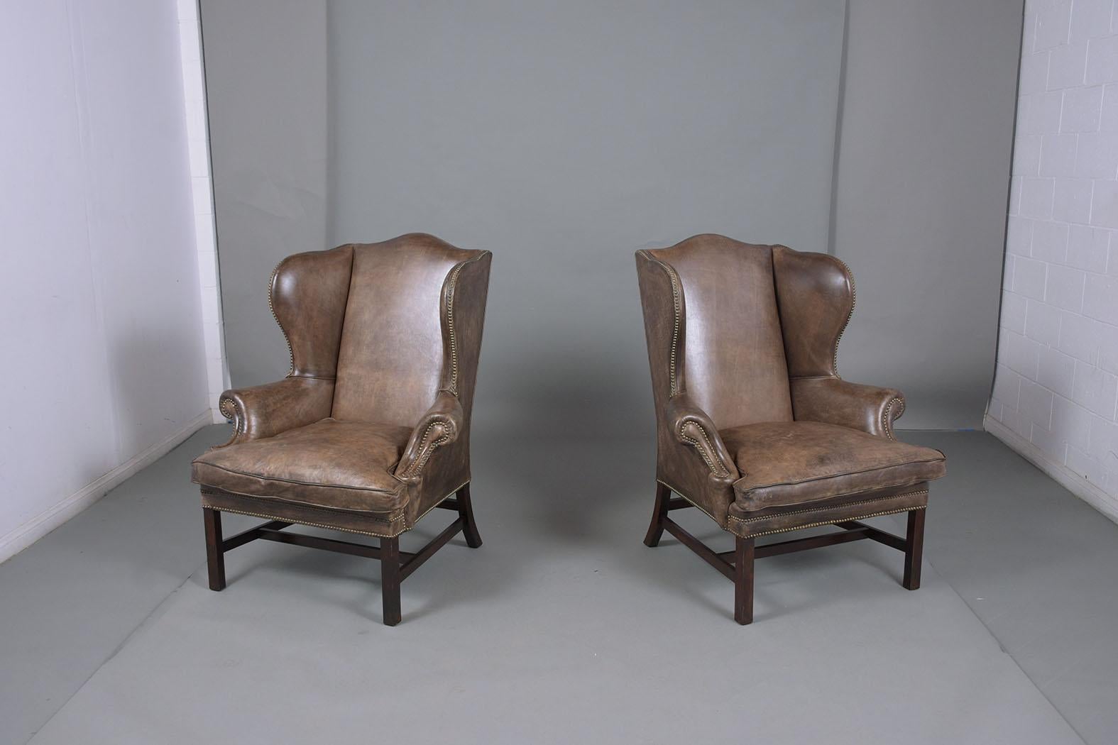 An extraordinary pair of Ralph Lauren Regency-style chairs excellent crafted out of wood are eye-catching and features an original dyed light brown leather color in a good condition that has been just cleaned and polished developing a beautiful