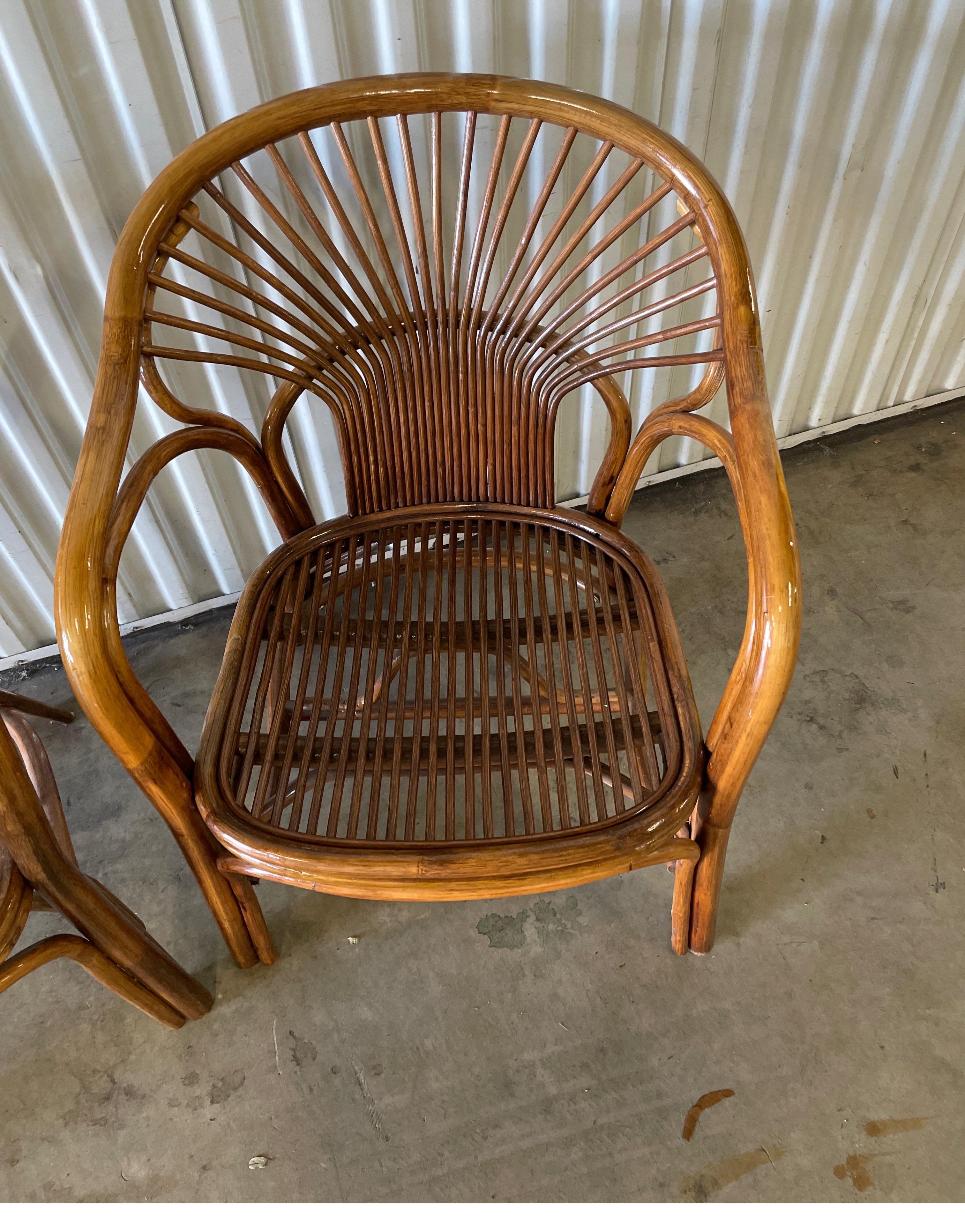 Vintage pair of rattan armchairs with pencil bamboo seat and back.