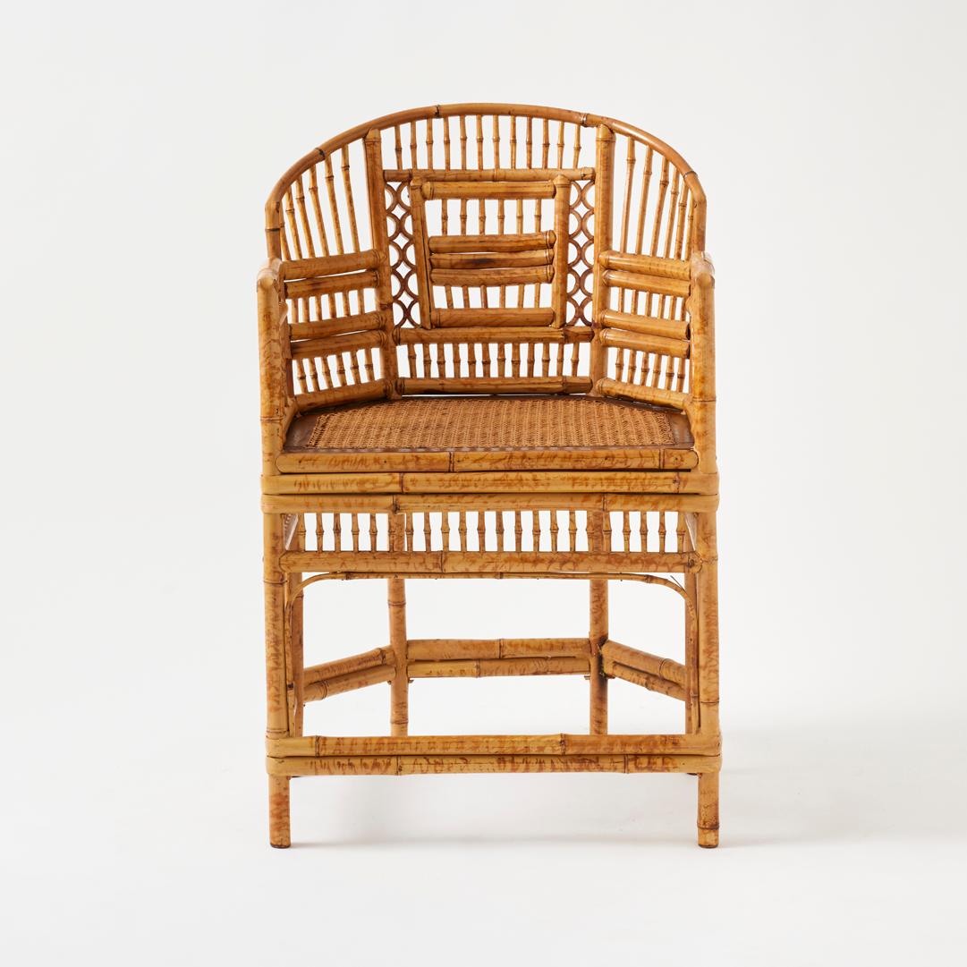 - Graphic and playful, this pair of vintage Brighton Pavilion chairs features a 6-leg design and is a stunning example of the form in mint condition.

- Geometric Chippendale fretwork adorns the backs, sides, and aprons, making these a sculptural
