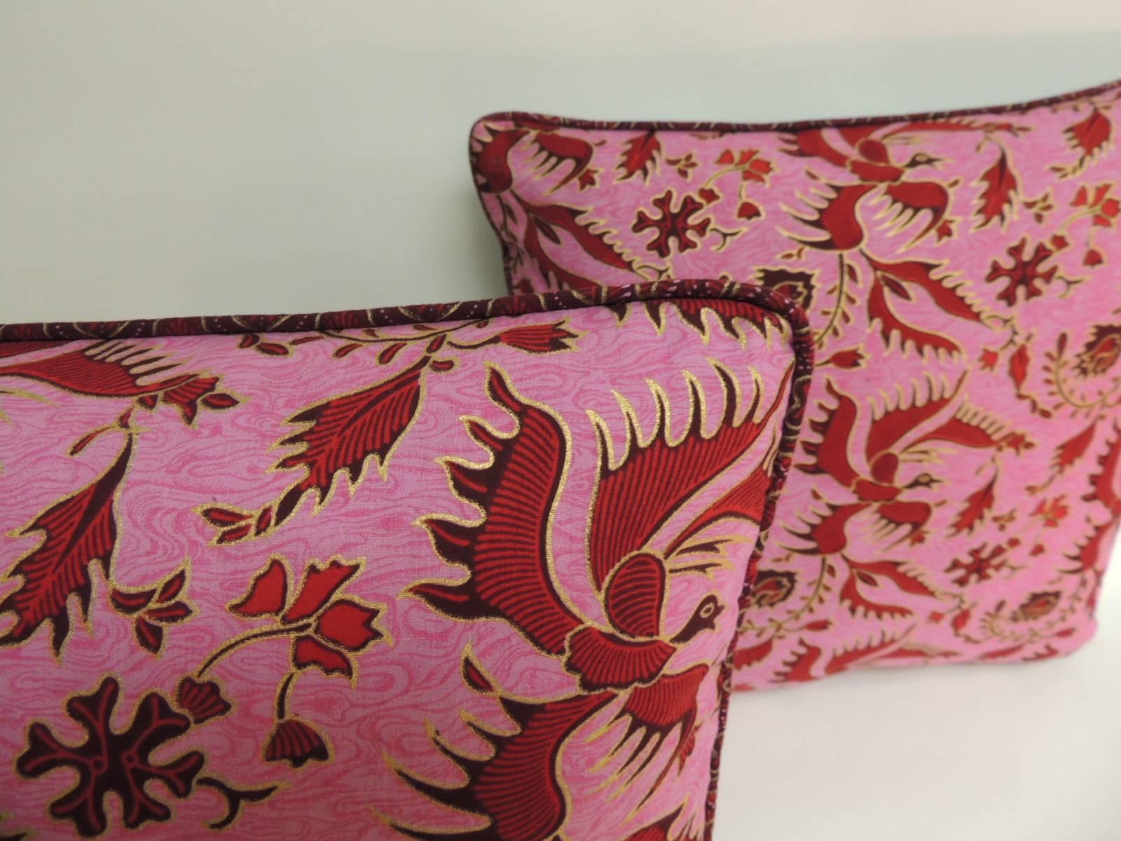 Pair of Vintage Red and Pink Hand-Blocked Batik Decorative Pillows.
Vintage textile depicting cranes, fishes and flowers. 
Decorative pillows embellished with a custom-made piping with the same 
Batik textile and finished with turquoise silk