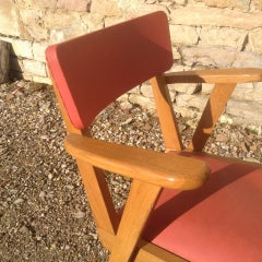 Pair of vintage red leatherette armchairs