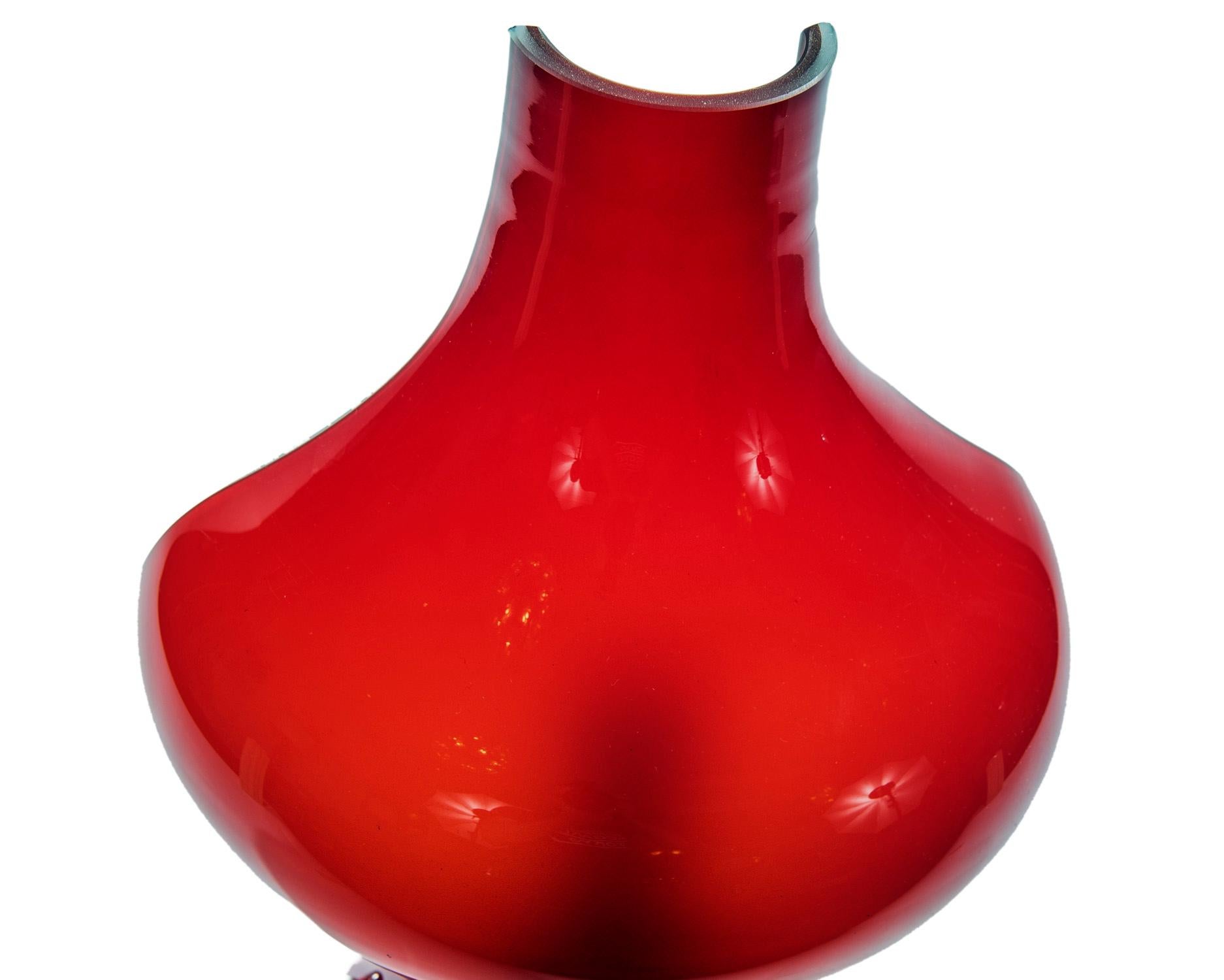 These fun and dynamic rich red single light urn shaped wall sconces are from Murano and are ready to hang.
A deep garnet red color when unlit that becomes a ruby red when lit.