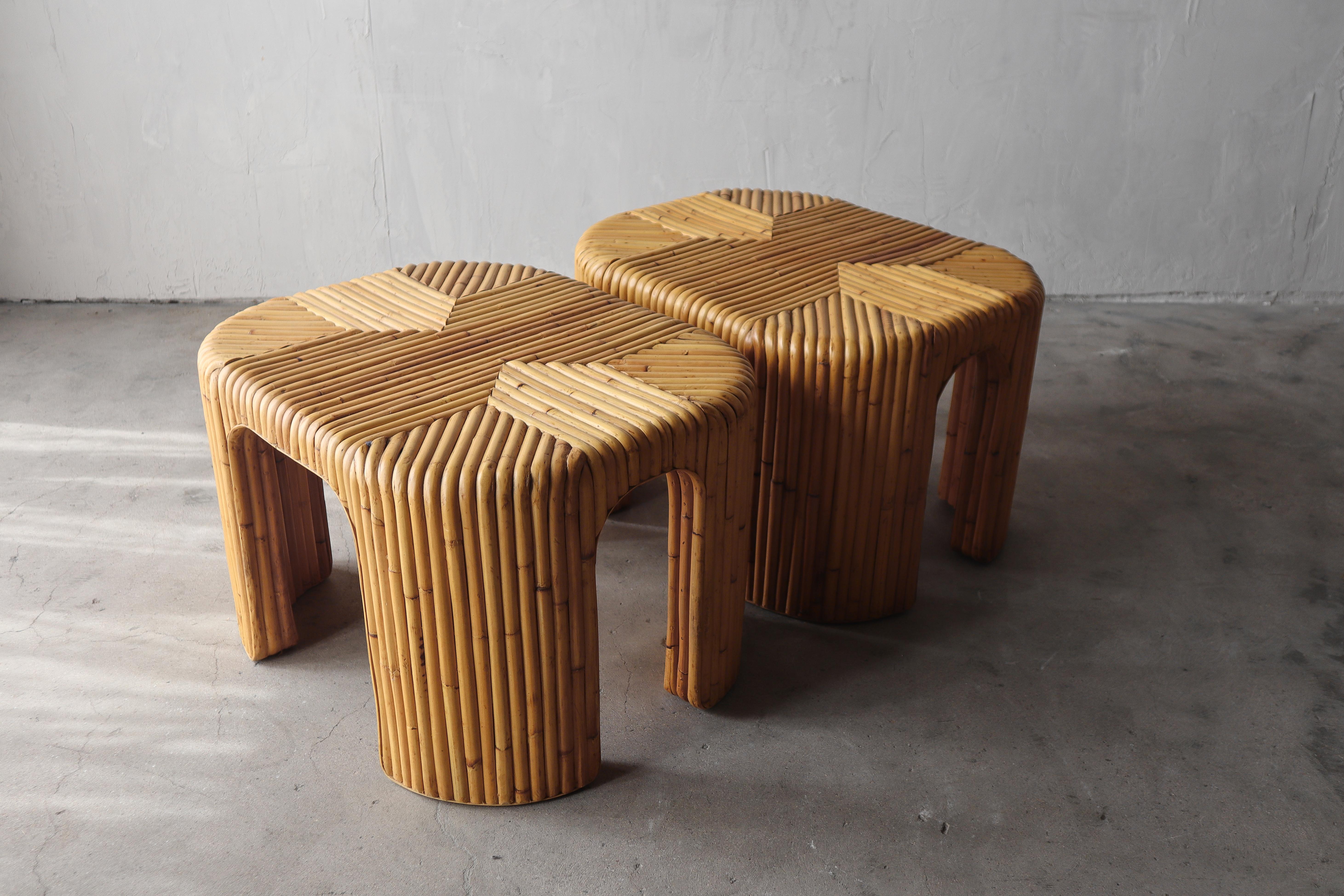 Incredible pair of vintage bamboo side tables. Bamboo is laid in an intricately decorative pattern and the legs create arches, creating true visual interest. Tables are quite substantial. They are large enough to be used together as a coffee