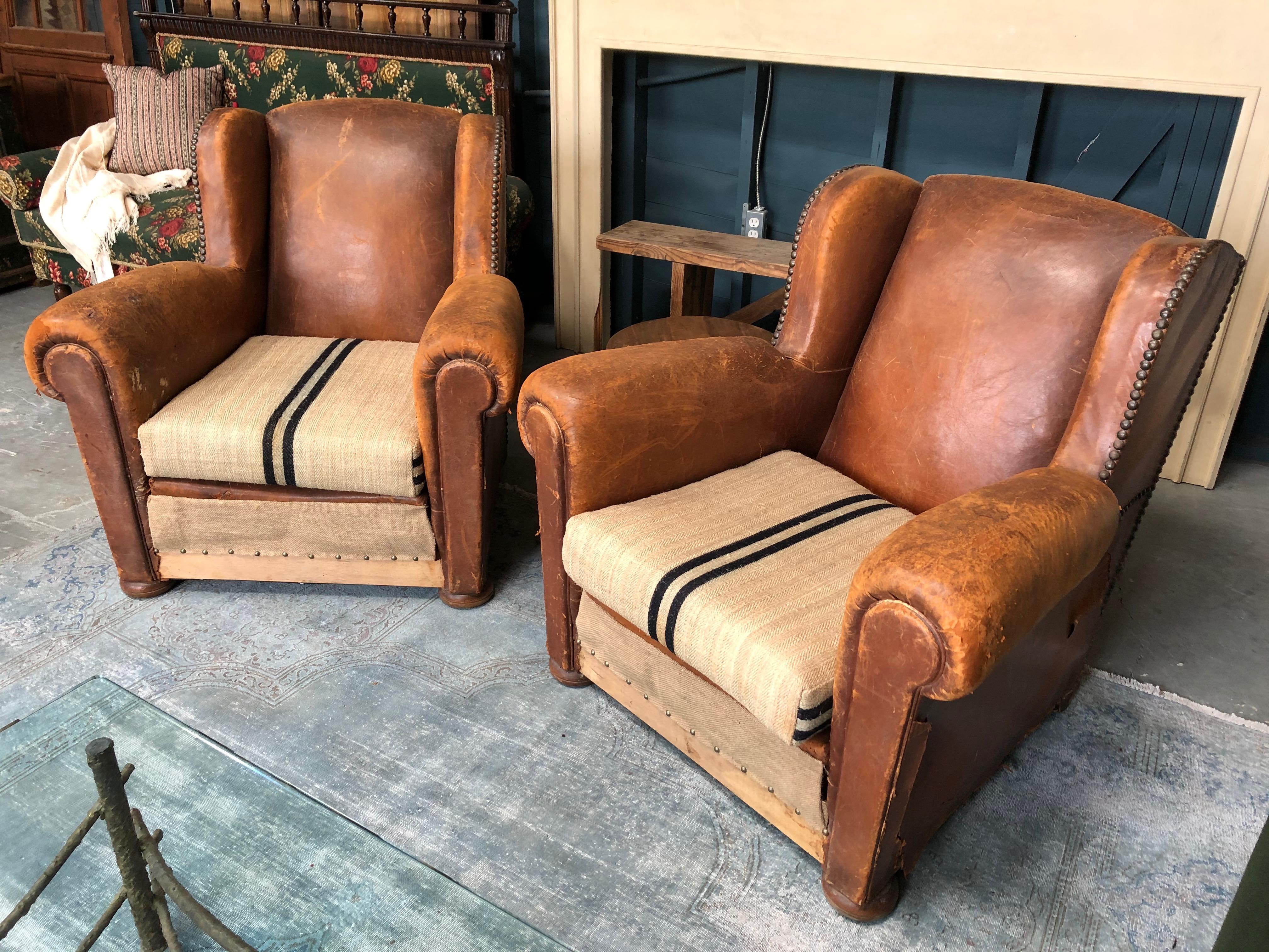Timeless 1930's club chairs that have been partially reupholstered with vintage French grain sack fabric. They are in great vintage condition.

Measures: 35 W x 32 D x 35.5 H

1 pair in stock

Sold as a pair.
