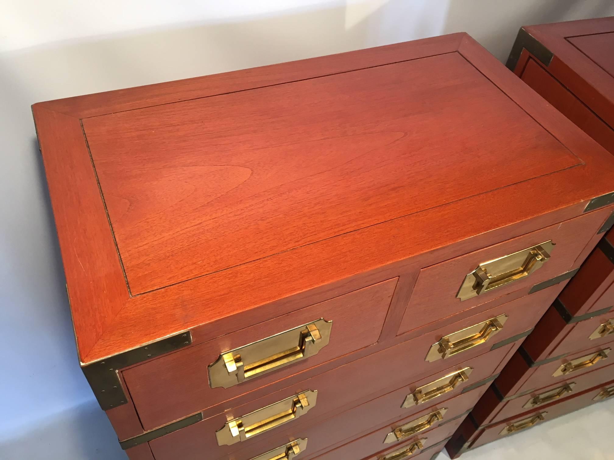 Pair of rosewood campaign dressers by George Zee & Company. Each chest complimented by brass pulls and generous corner hardware.