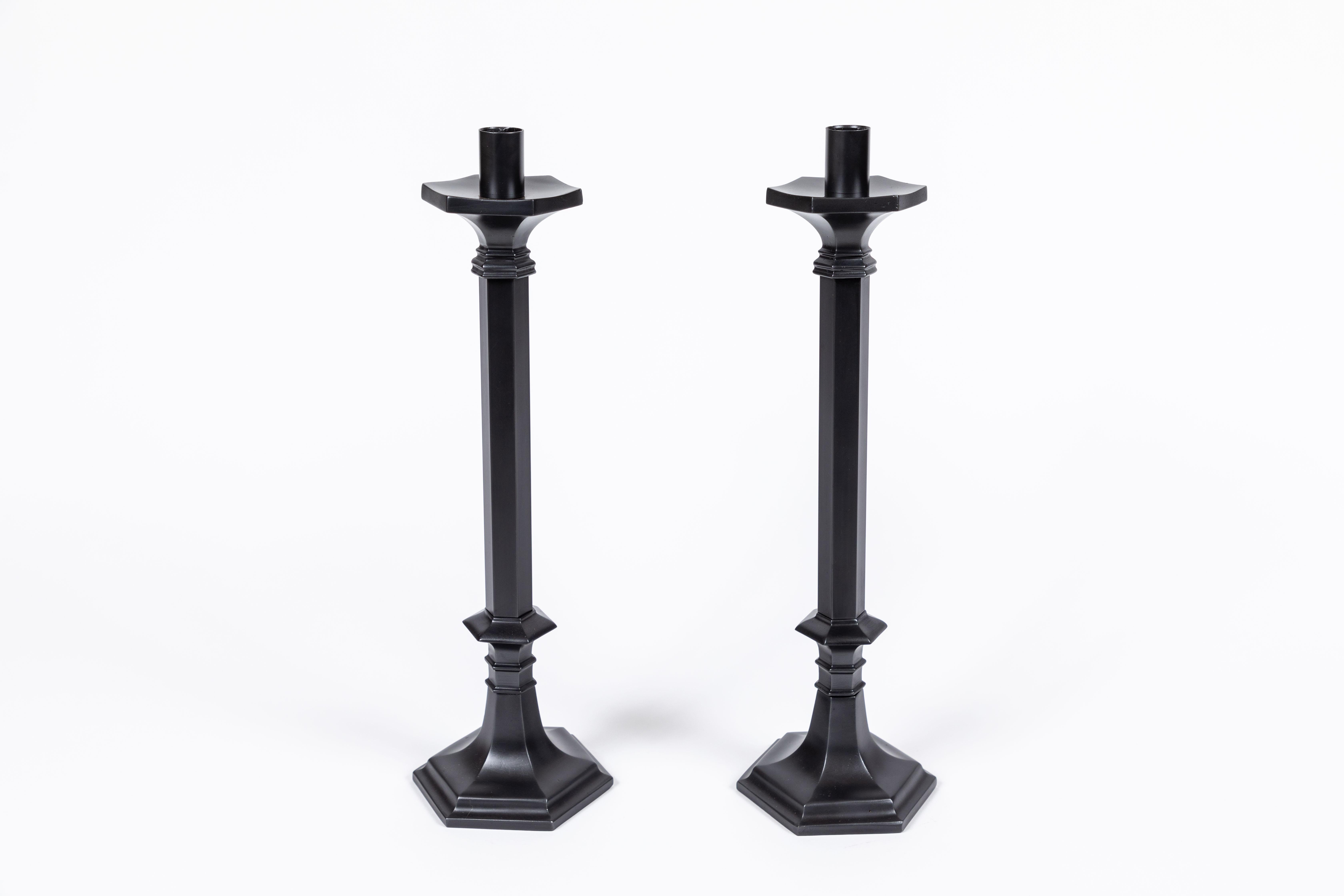 Outstanding pair of tall vintage heavy 'Rostand' stick brass candlesticks. They have been refurbished with a new oil rubbed bronze finish. Quite a statement on any table!