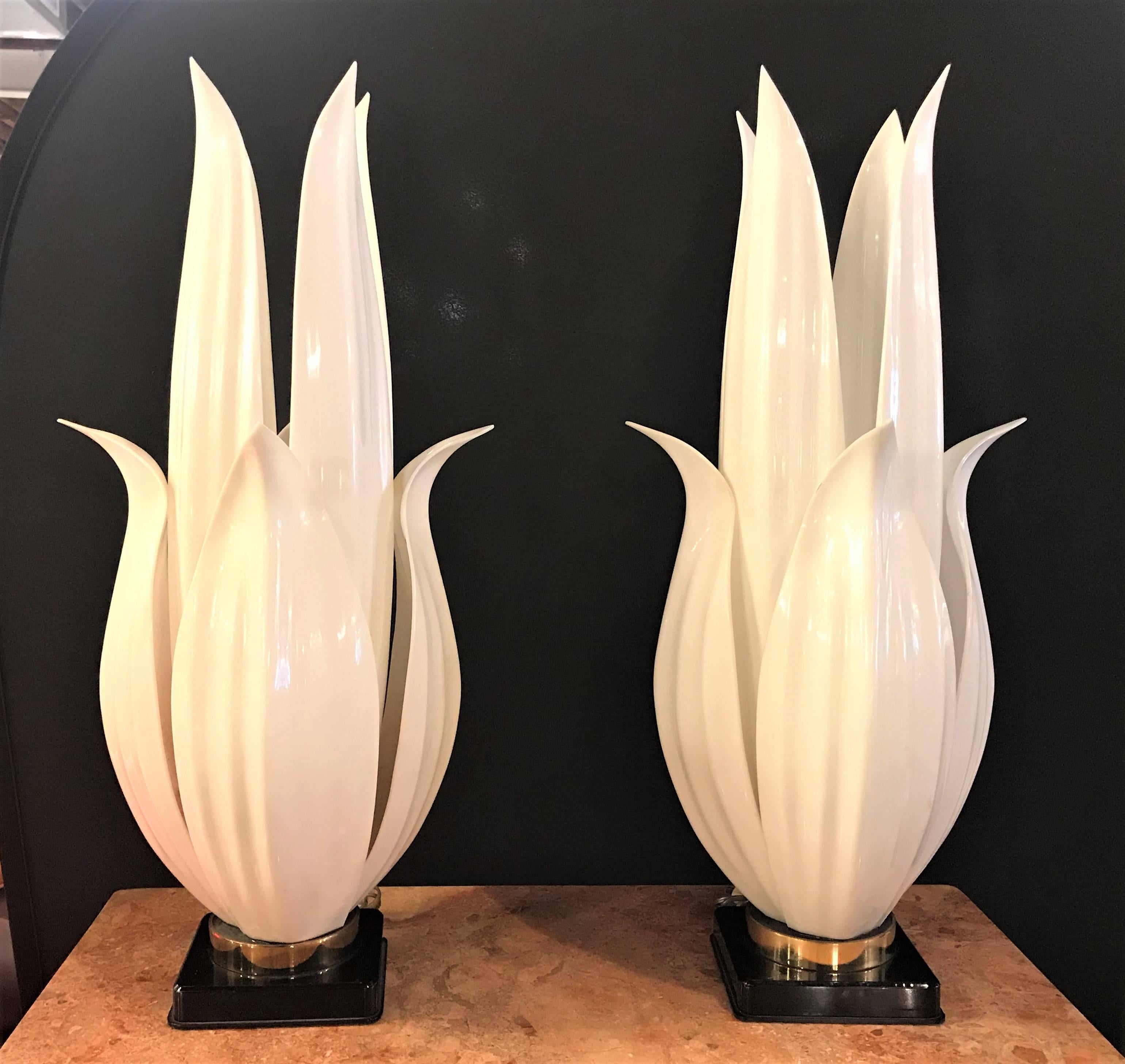 A pair of vintage Mid-Century Modern Rougier labelled table lamps crafted of white Lucite with brass hardware and black lacquer bases, circa 1970. Each bearing the tag Rougier.