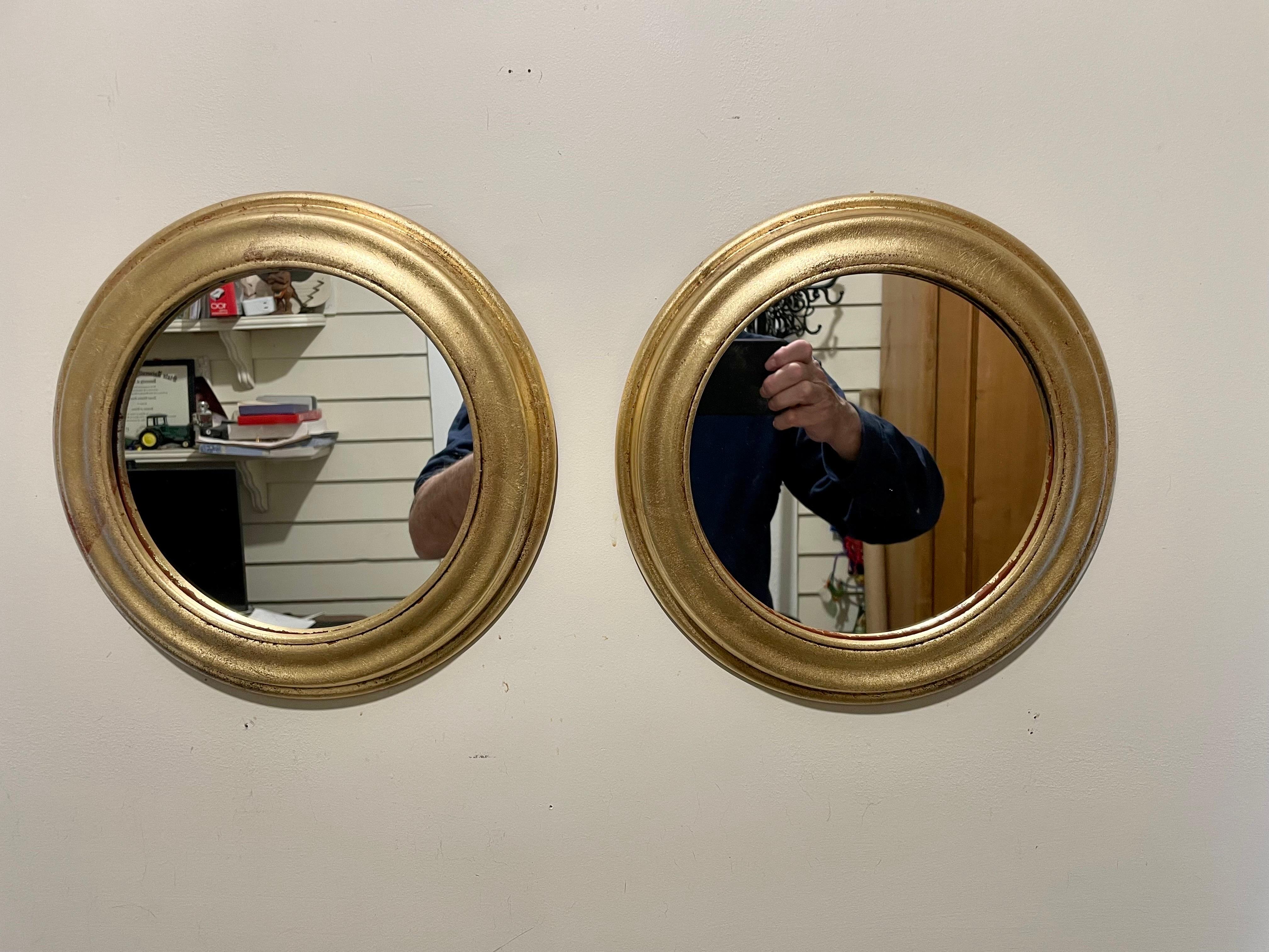 Pair Italian gilt finish round wood mirrors. Each mirror is 11