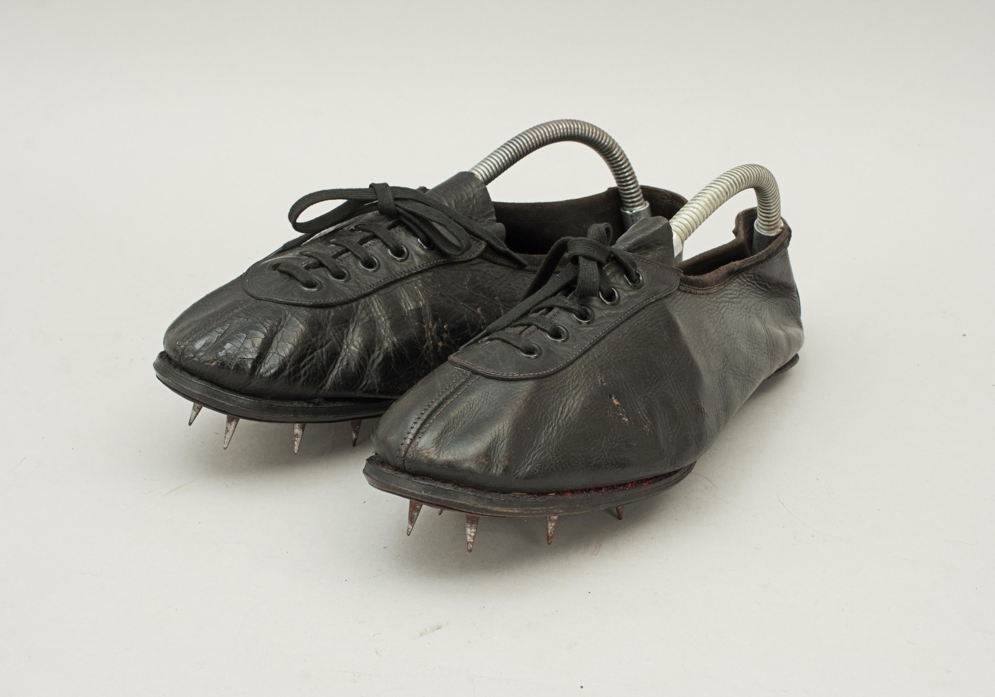 Vintage running spikes.
A pair of all black leather running, sprinting, athletic shoes. The size 8 leather soled running spikes are in good condition and have 6 1½ cm metal spikes in each sole. These sprint shoes would make a great present for a