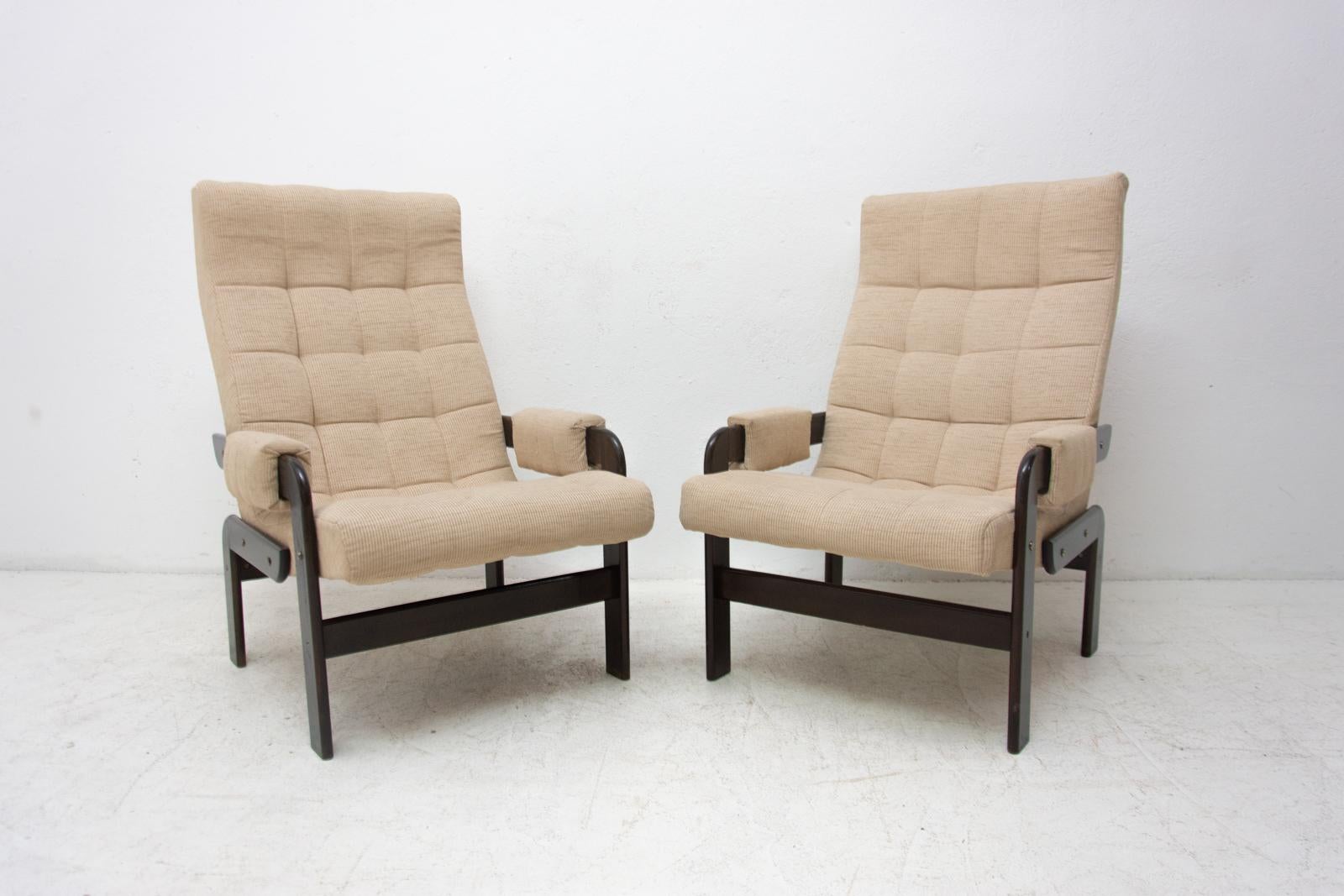 A pair of Vintage Scandinavian armchairs made in the 1970s. It has a beechwood structure and original upholstery in good Vintage condition. The chairs are fully functional in very good condition, very nice design retro chic. Price is for the pair.