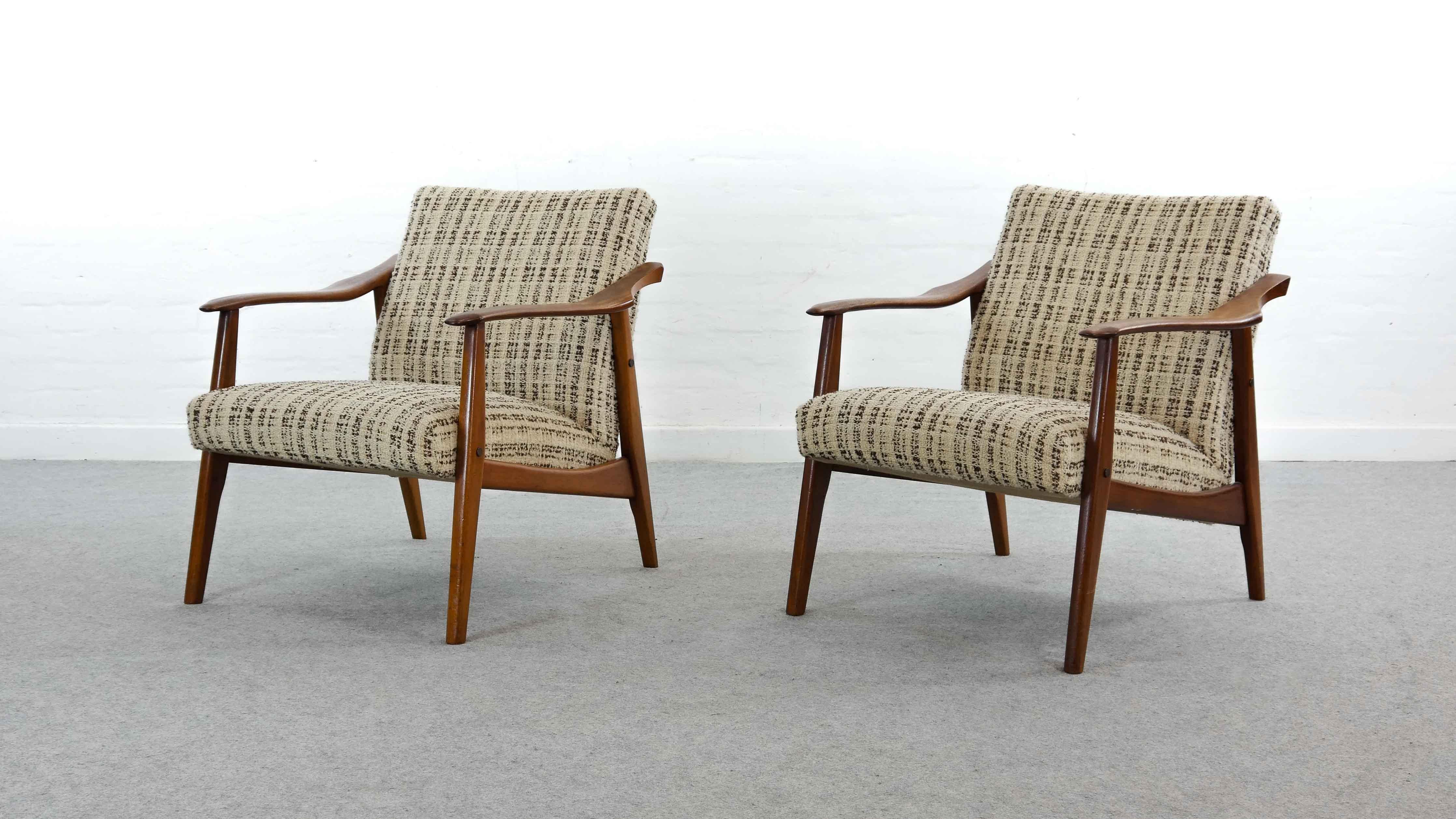 Pair of vintage Scandinavian armchairs from the 1960s, Mid-Century Modern teakwood. Armrests show sculptural and eccentric shape. Upholstered in original woolfabric. Designer and manufacturer unknown.