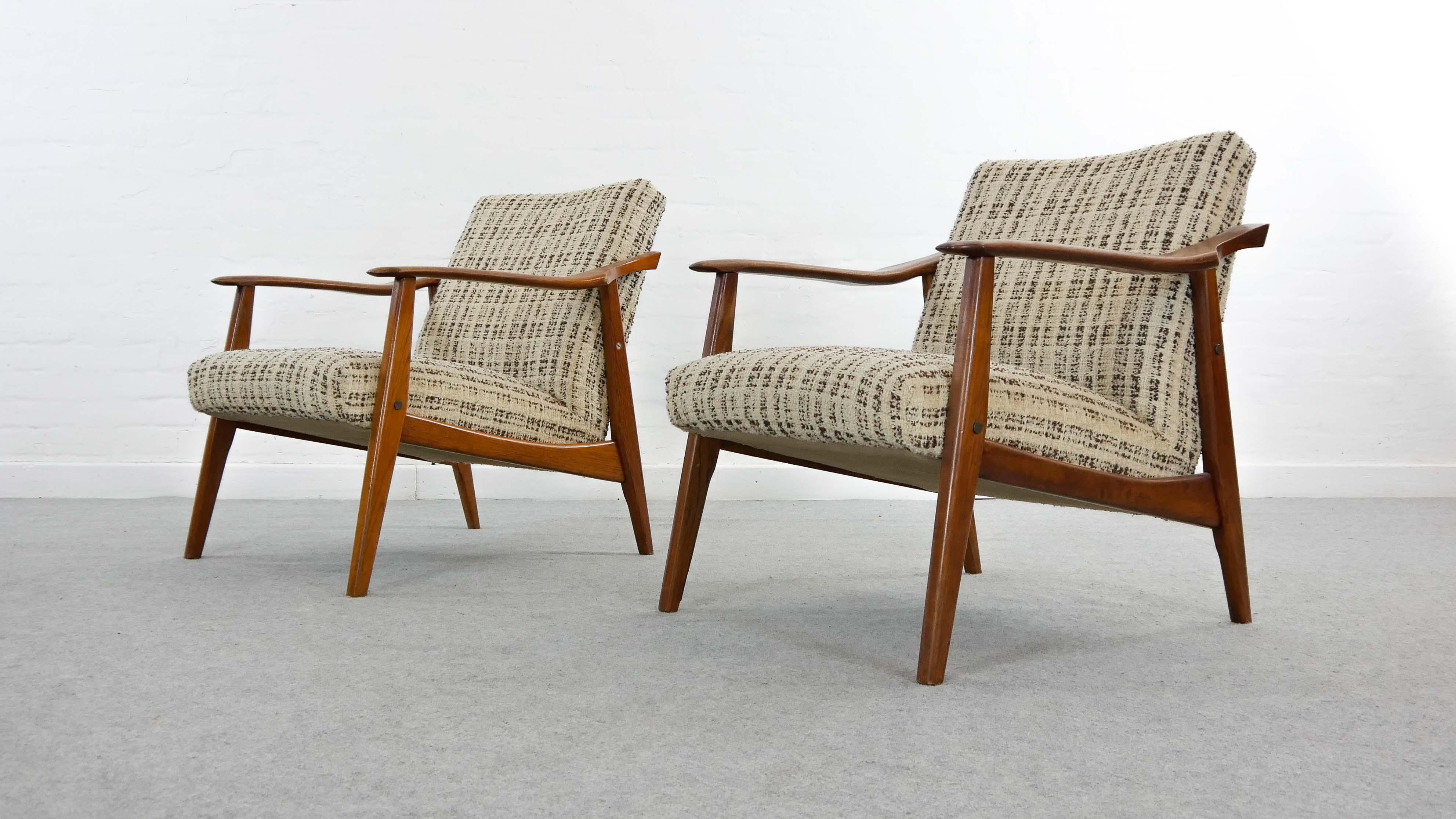 Pair of vintage Scandinavian armchairs from the 1960s, Mid-Century Modern teakwood. Armrests show sculptural and eccentric shape. Upholstered in original woolfabric. Designer and manufacturer unknown.