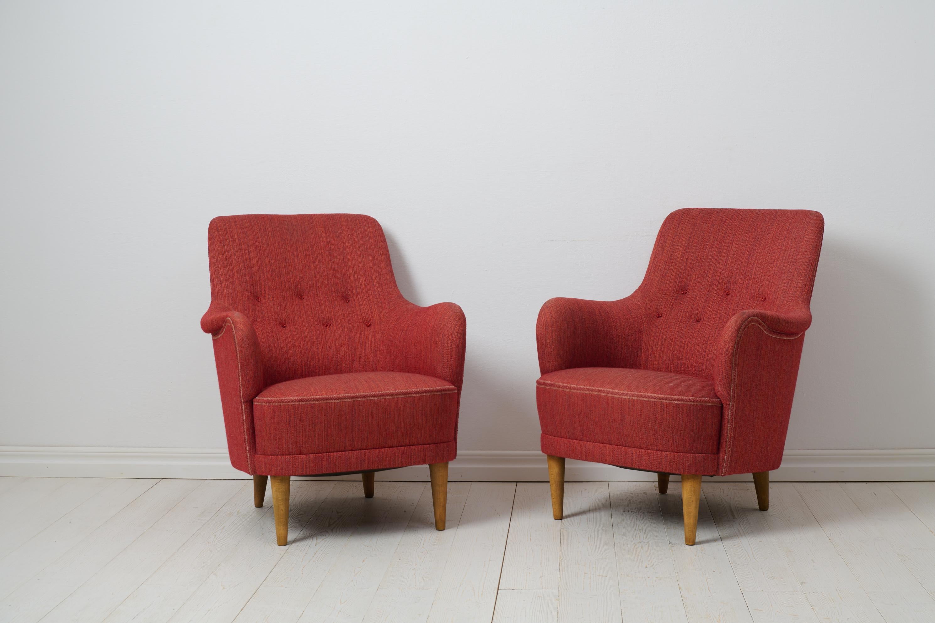 Carl Malmsten Samsas armchairs for O.H. Sjögren from the mid 20th century. The chairs are a Swedish modern classic and the Samsas series is today recognised as the most characteristic designs from Malmsten. The armchairs Samsas is a 1960s favourite