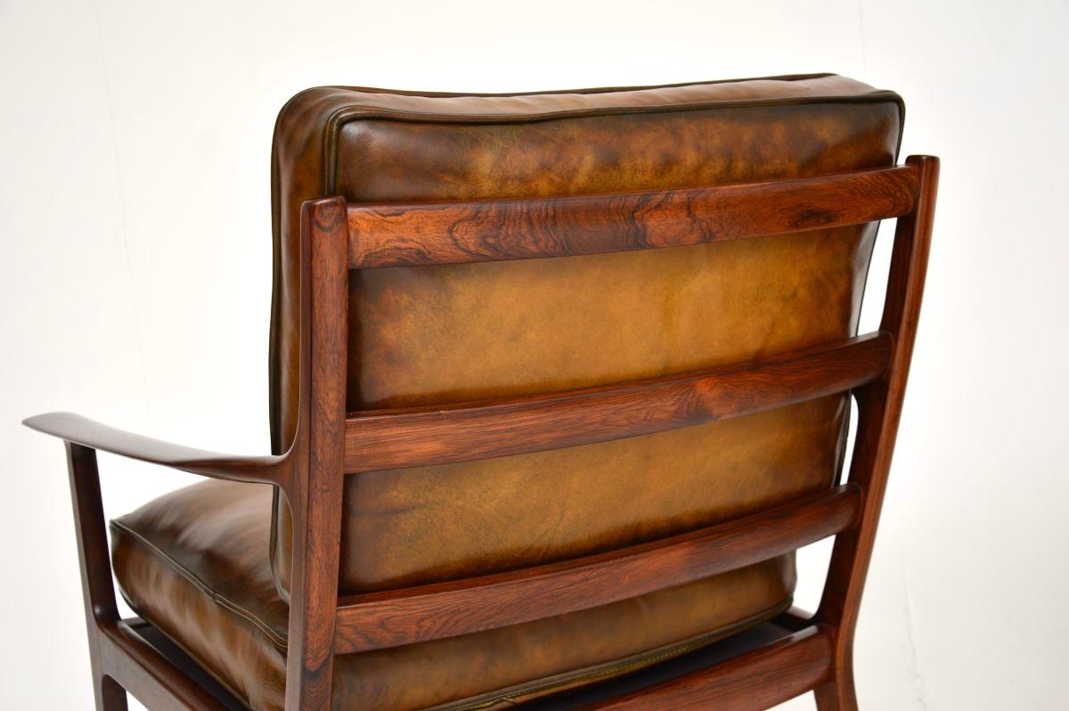 Pelle Coppia di poltrone scandinave d'epoca in palissandro e pelle di Frederik Kayser in vendita