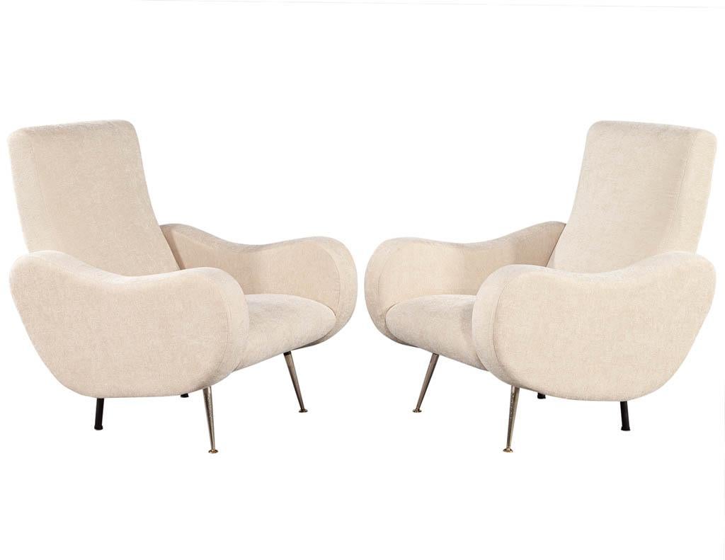 Pair of vintage sculpted Italian Zanuso style lounge chairs. Upholstered in a beautiful textured beige fabric. Original 1970’s Italian design with new upholstery work.

Price includes complimentary curb side delivery to the continental USA.