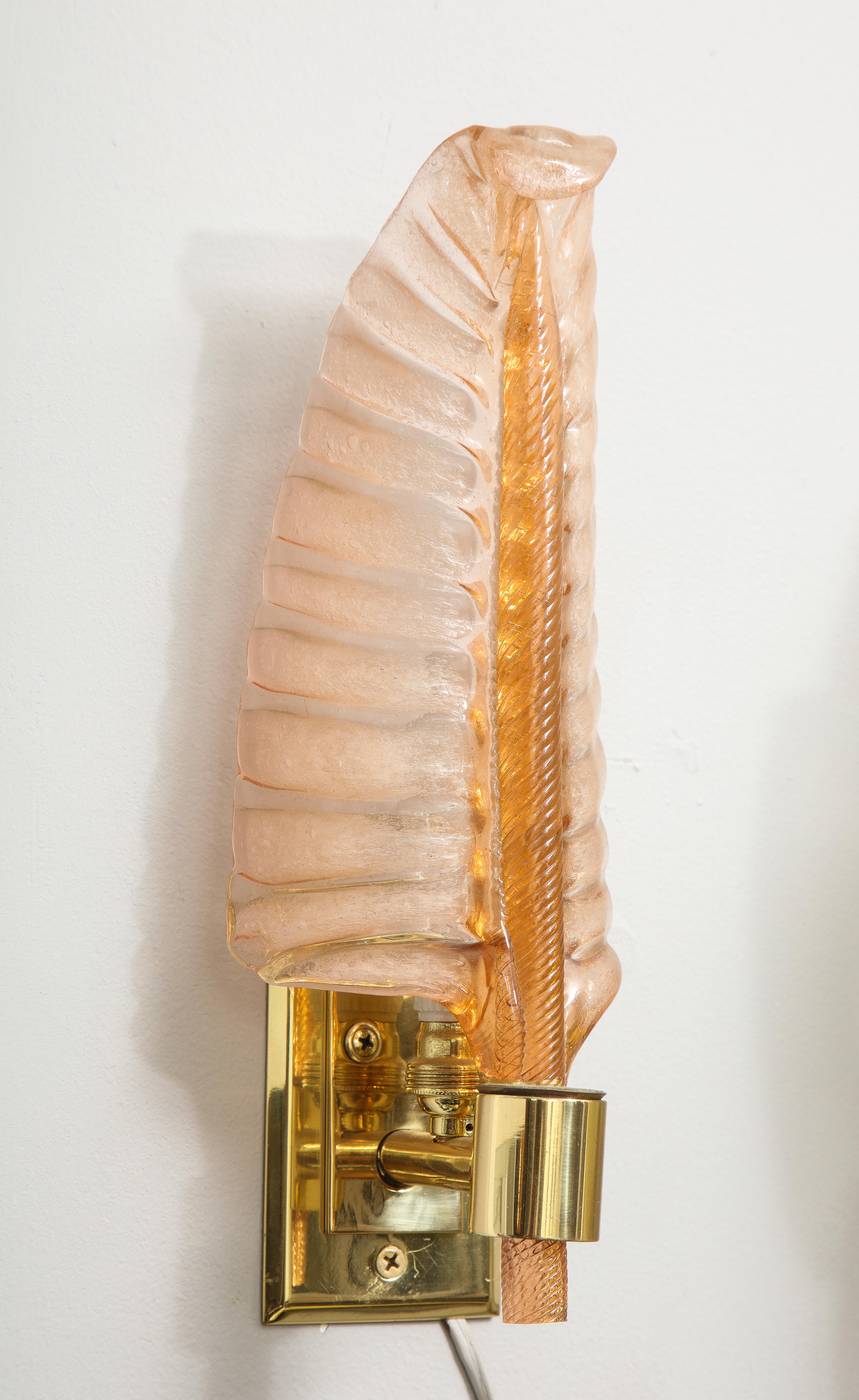 Pair of vintage rose colored Seguso feather sconces.