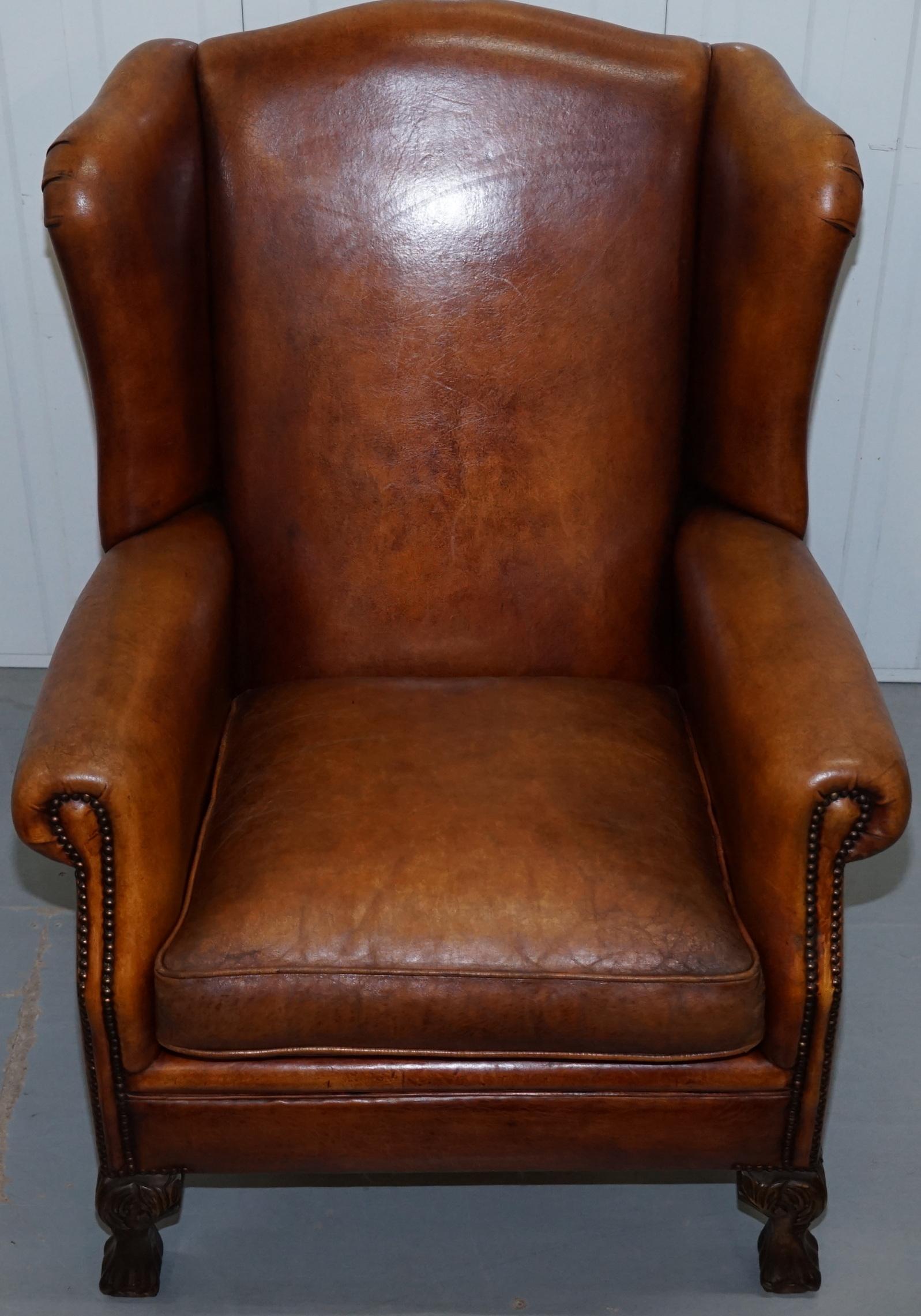 Danish Pair of Vintage Sheepskin Leather Aged Brown Wingback Armchairs Carved Wood Legs