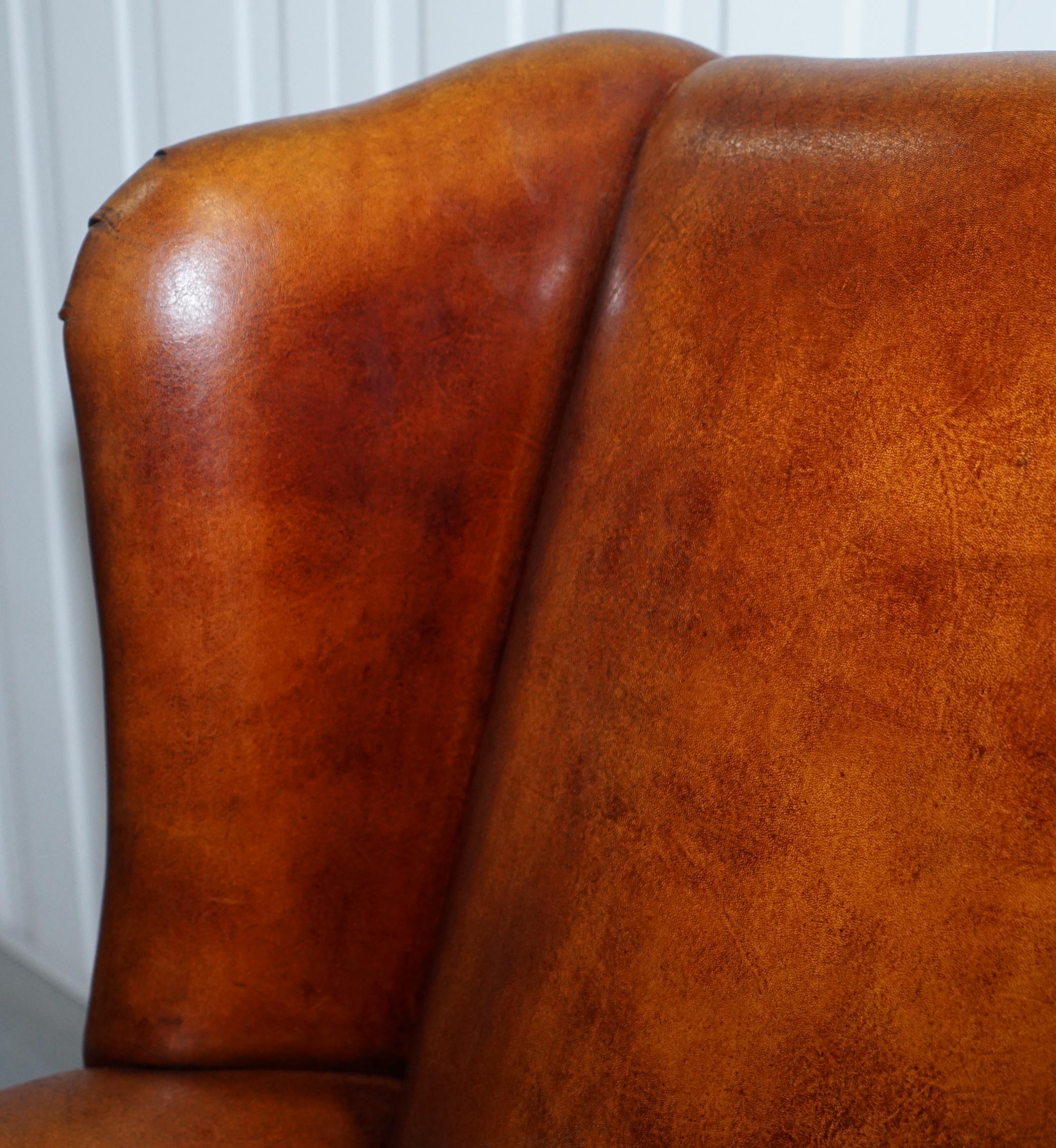 Pair of Vintage Sheepskin Leather Aged Brown Wingback Armchairs Carved Wood Legs 1