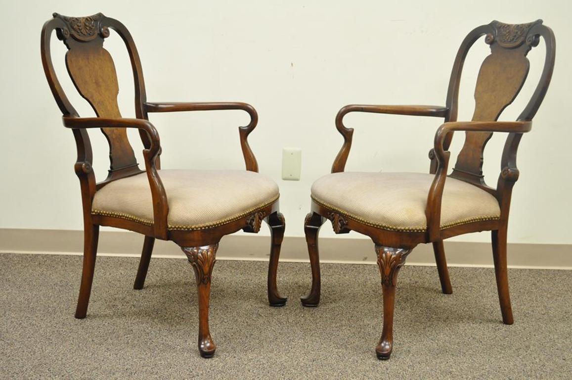 Quality Pair of Vintage Shell Carved Burl Wood & Walnut George II Style Dining Arm Chairs. Item features shapely Queen Anne style legs, Carved backs plats and lower rail, Curvaceous arms, Shell carved detailing,Maker is unconfirmed but quality is