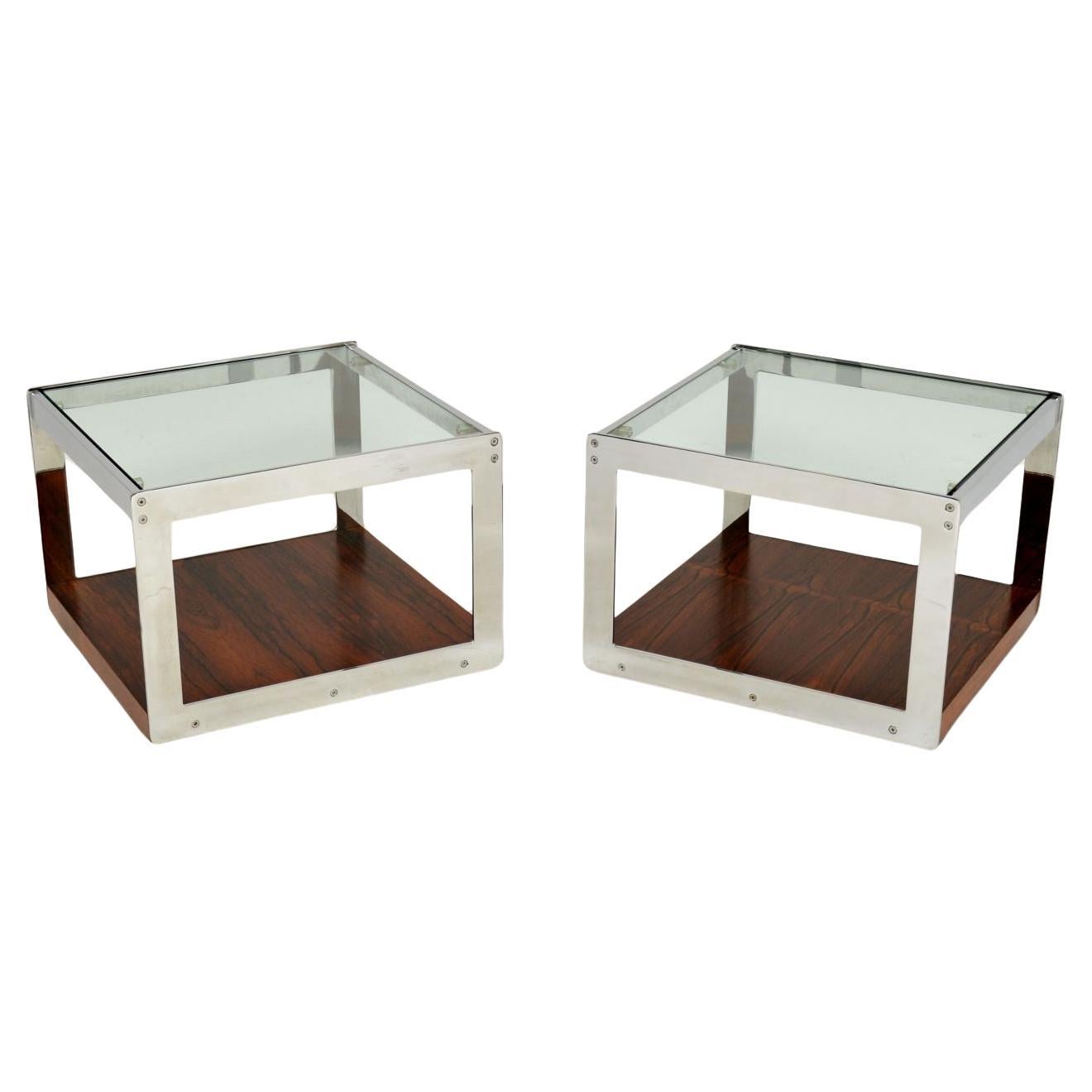 A superb pair of vintage side tables by Merrow Associates. They were designed by Richard Young and made in England in the early 1970’s.

This iconic design is of amazing quality, this pair are a useful and practical size. The wooden bases have