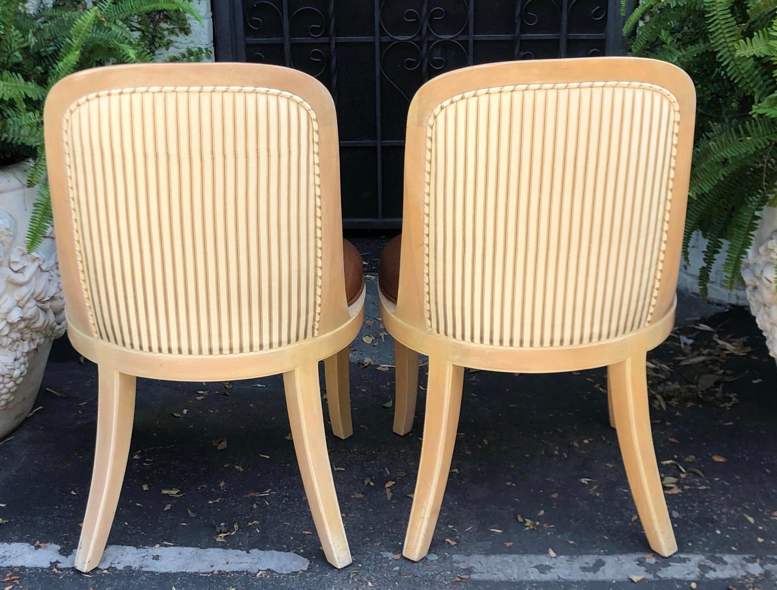 Pair of vintage signed Donghia Modern Designer side chairs by John Hutton. Each features snake embossed leather seats, lams fur backs and J. Robert Scott silk stripe verso.