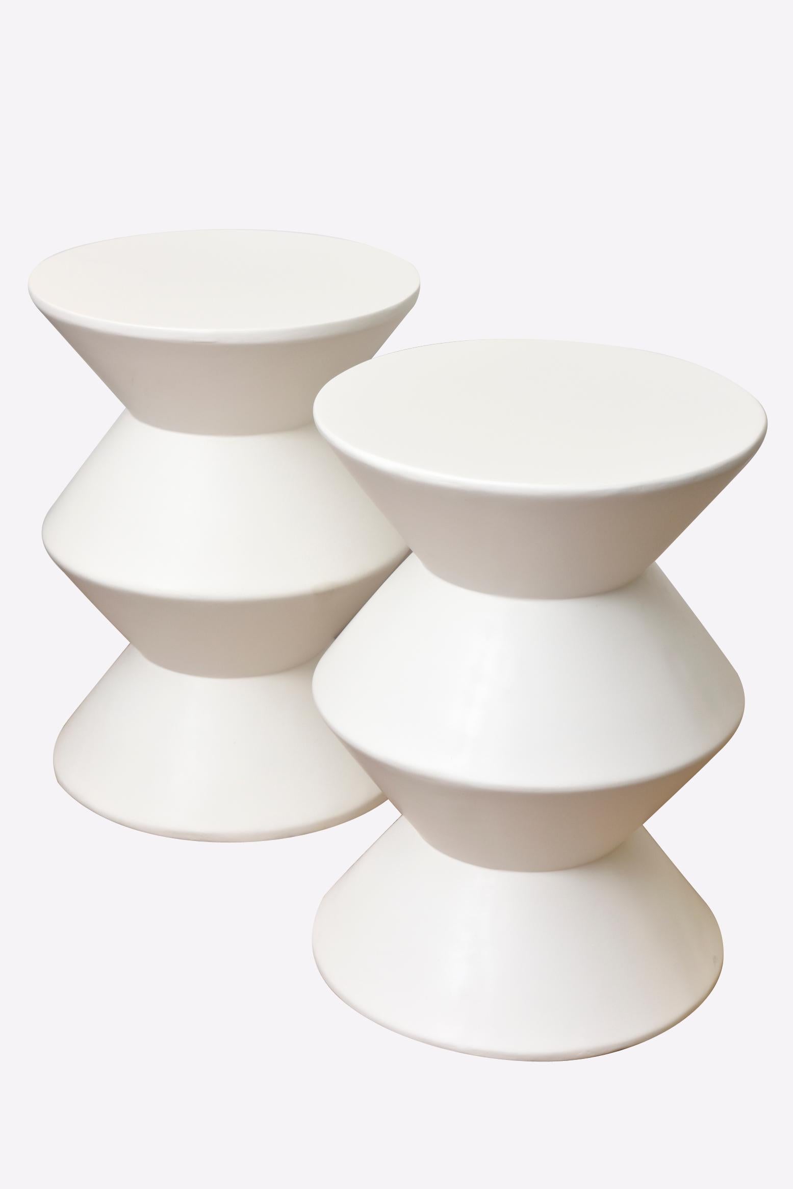 These amazing and rare modernist sculptural tiered white vintage Sirmos plaster of paris side tables are beyond chic! They are from the 1970s.
They have a John Dickinson style meets Sirmos in a sculptural manner. They are modernist and sculptural.