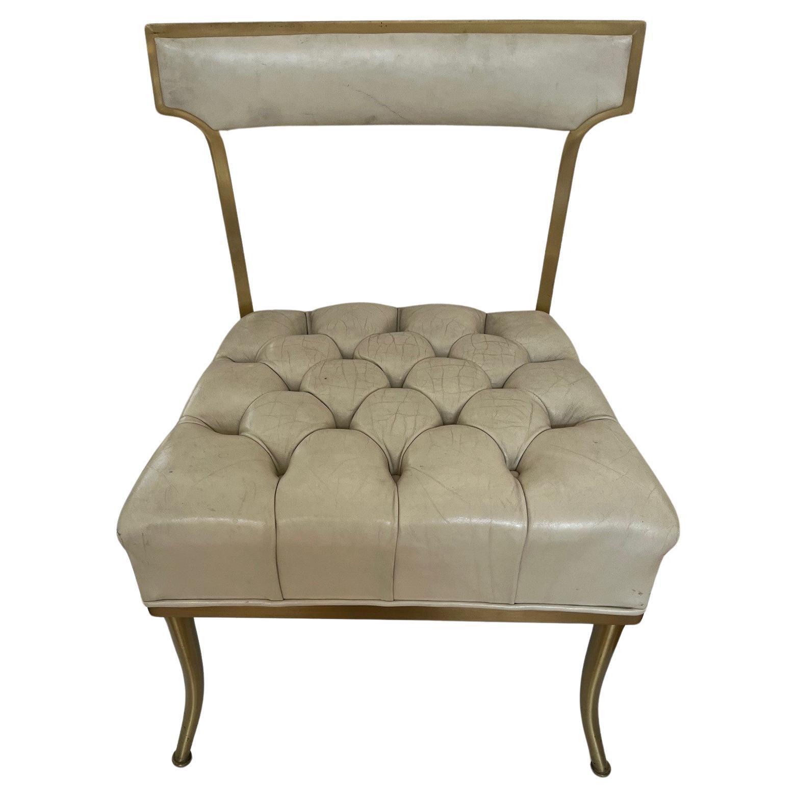 Pair of Vintage Sleek Tufted Leather Klismos Chairs Designed by William Haines, circa: 1950s. Solid Brass and Brass Patina Frames that aged well, these Sleek Comfortable Chairs Stylized Klismos Form, open back Design with small Padded Backrest in