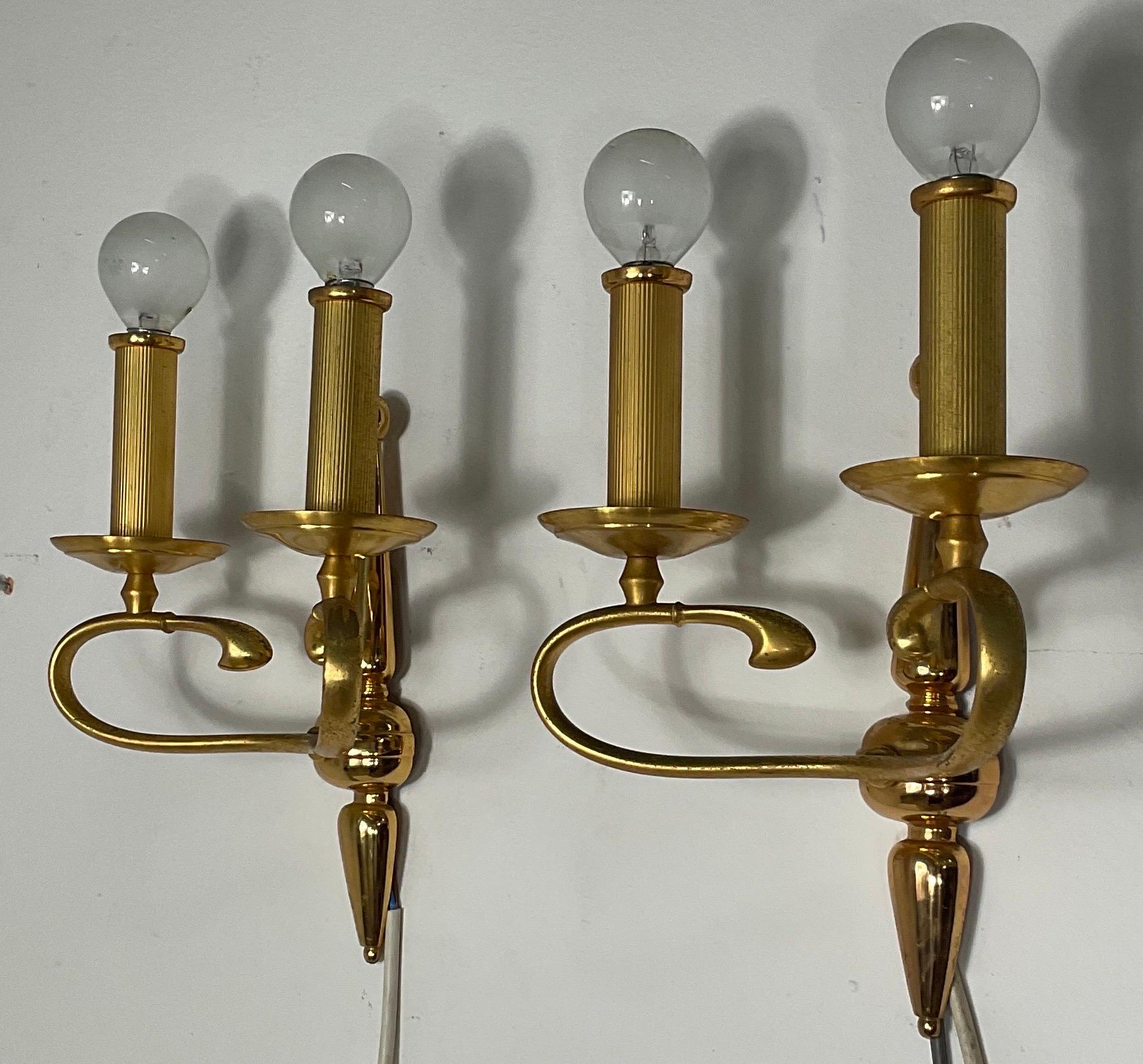 A pair of high quality solid brass italian wall sconces, they work 110-240 volts and need regular e14 bulbs. The brass original patina gives them a vibrant vintage look.