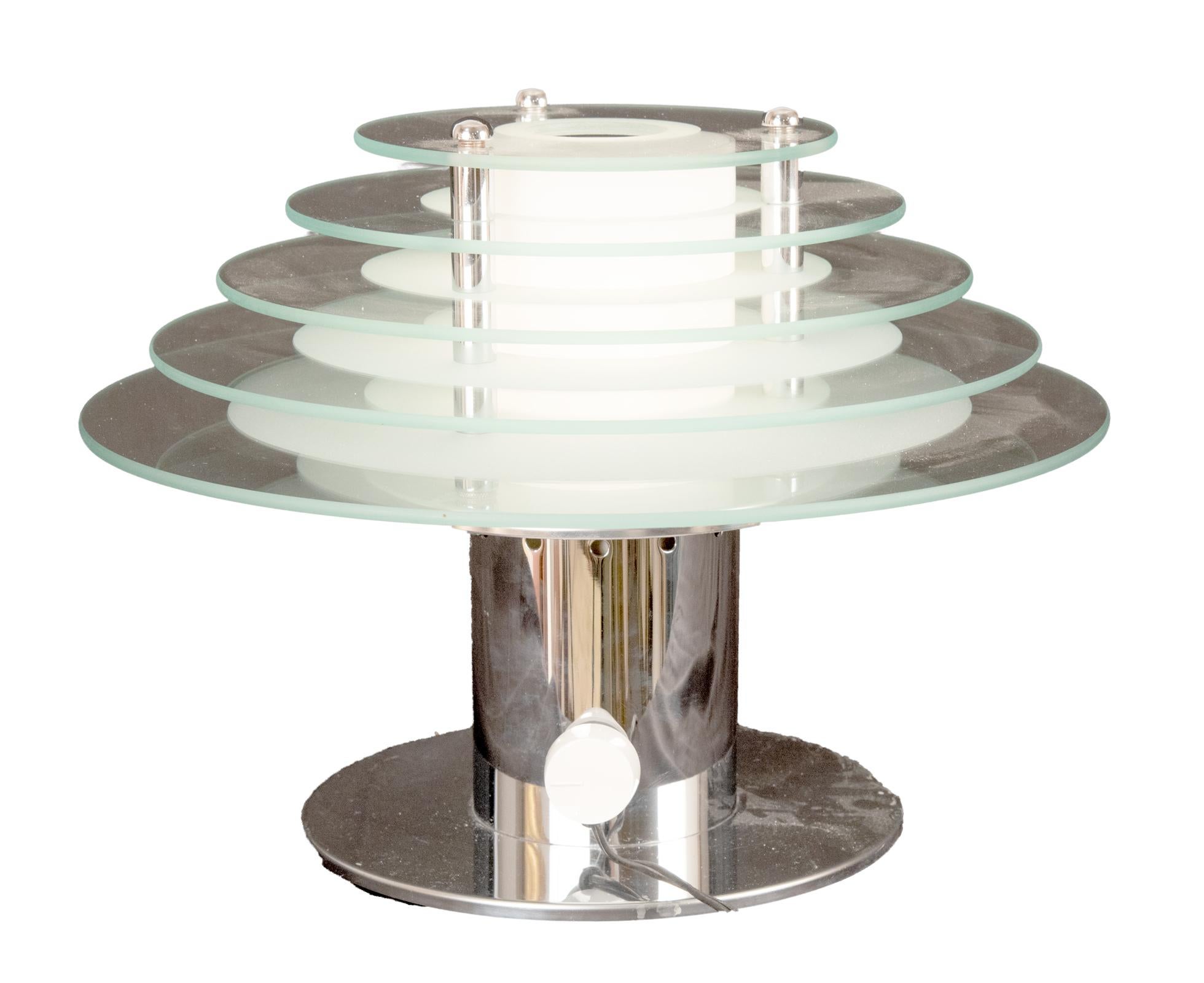 Inspired by the clean geometric lines of the Art Deco period, this rare pair of table lamps designed by Robert Sonneman for George Kovacs in 1987 represents the quintessential 1980s style. Chrome disk and cylinder bases support five graduated