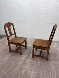Pair of Vintage Spanish revival knotty Pine chairs