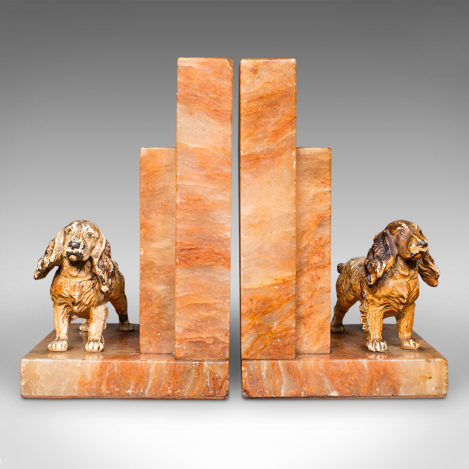 
This is a pair of Springer Spaniel bookends. An English, onyx marble and cast metal ornamental dog book rest, dating to the Art Deco period, circa 1930.

Striking bookends with appeal for fans of the breed
Displaying a desirable aged patina and in
