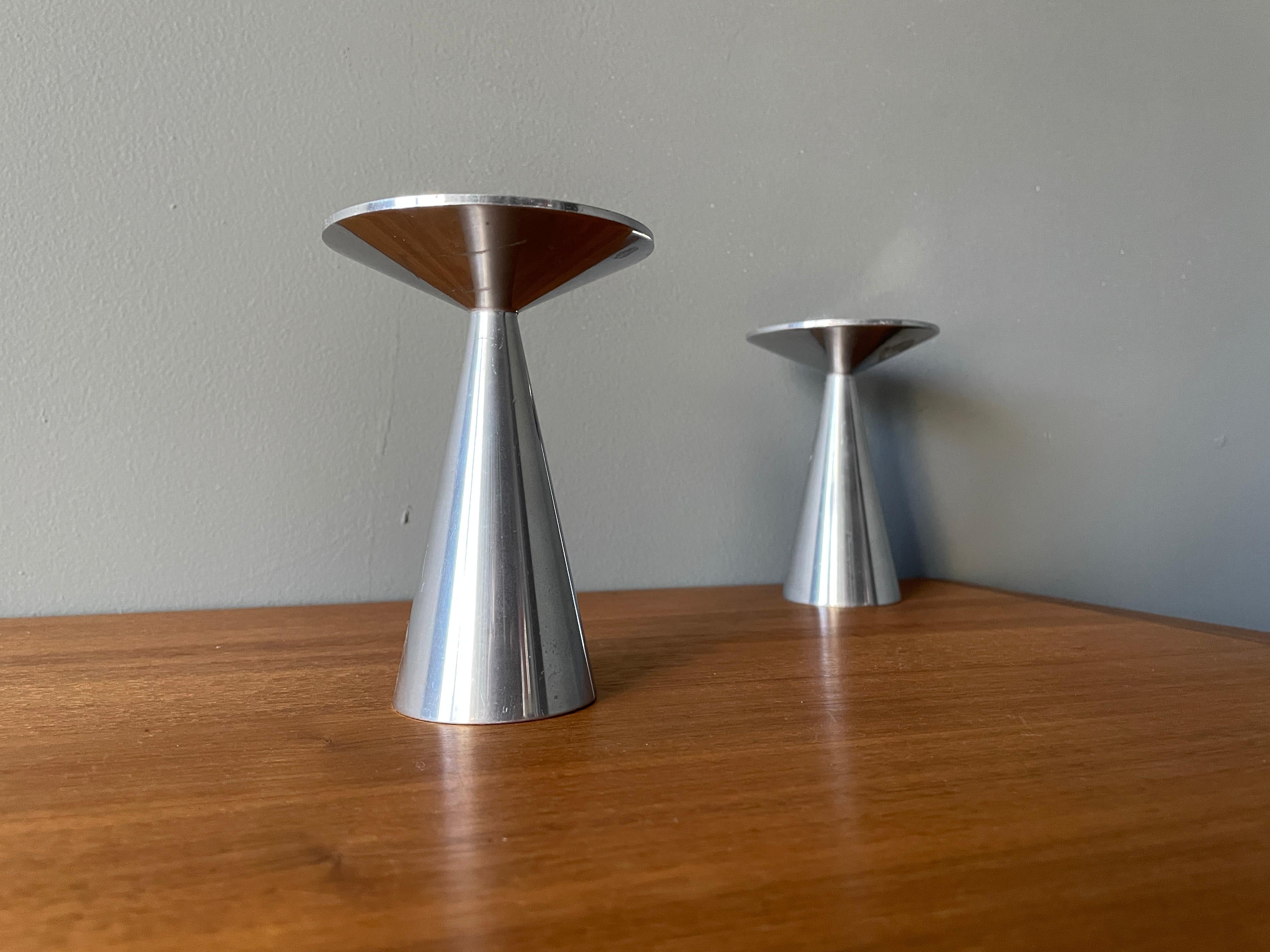 Pair of vintage Mid-Century Modern spun aluminum candle holders. Beautiful design and composition. Fits 2 larger size candles.