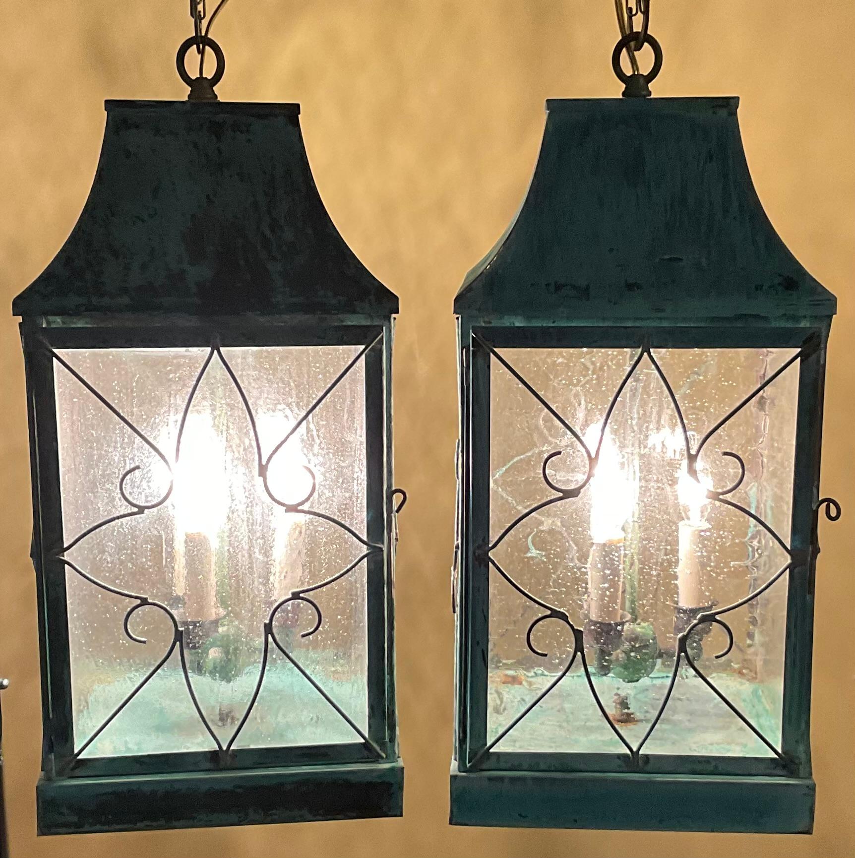 Beautiful four sides pair of hanging lanterns made of handcrafted solid copper and brass stem with three  40/watt lights, beautiful patina ,suitable for wet location ,Made in the US ,great look indoor or outdoor.  canopy and chain included.