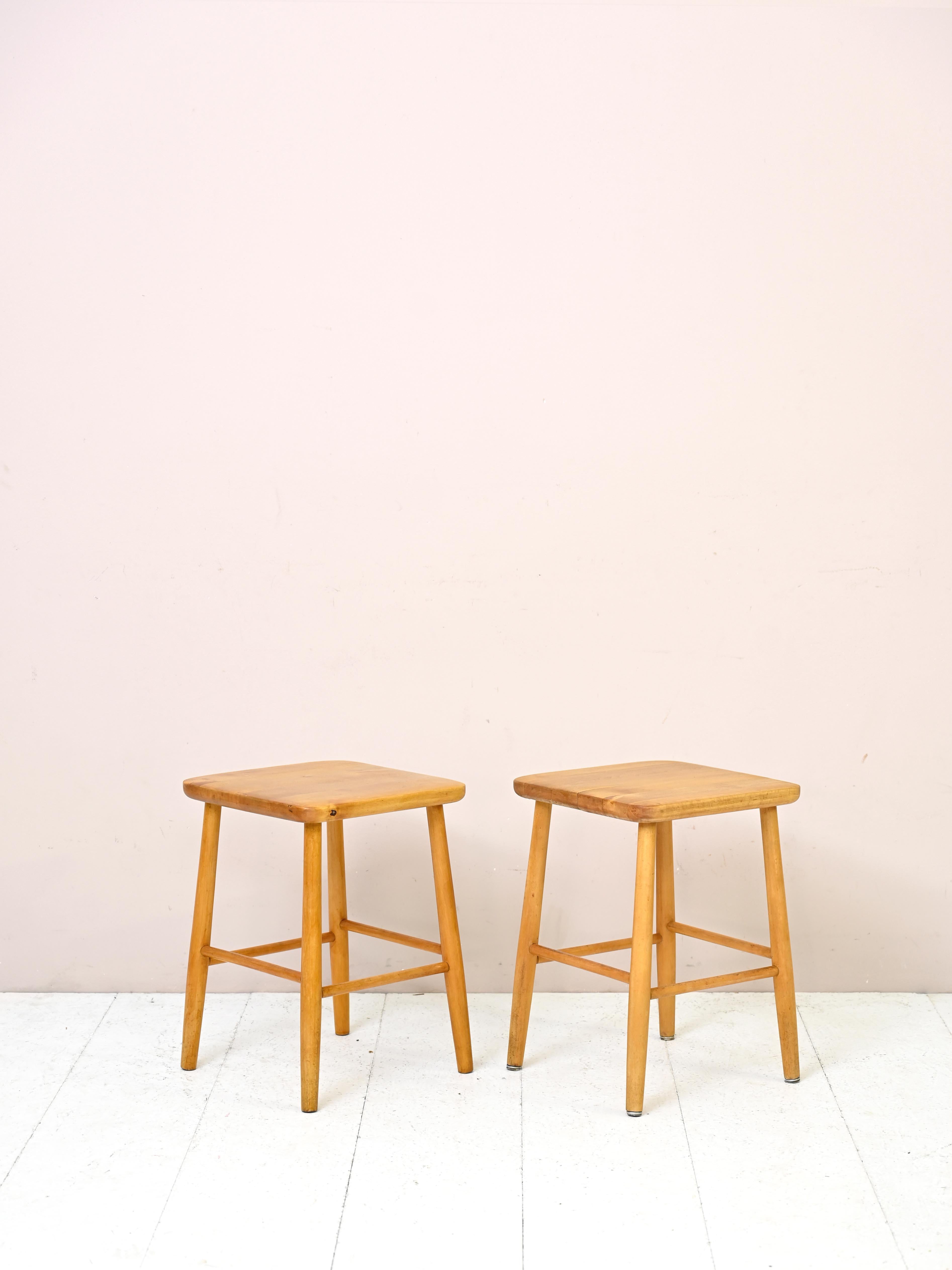 Small vintage birch stools from the 1960s.

This pair of vintage seats traces the style of the classic Nordic 